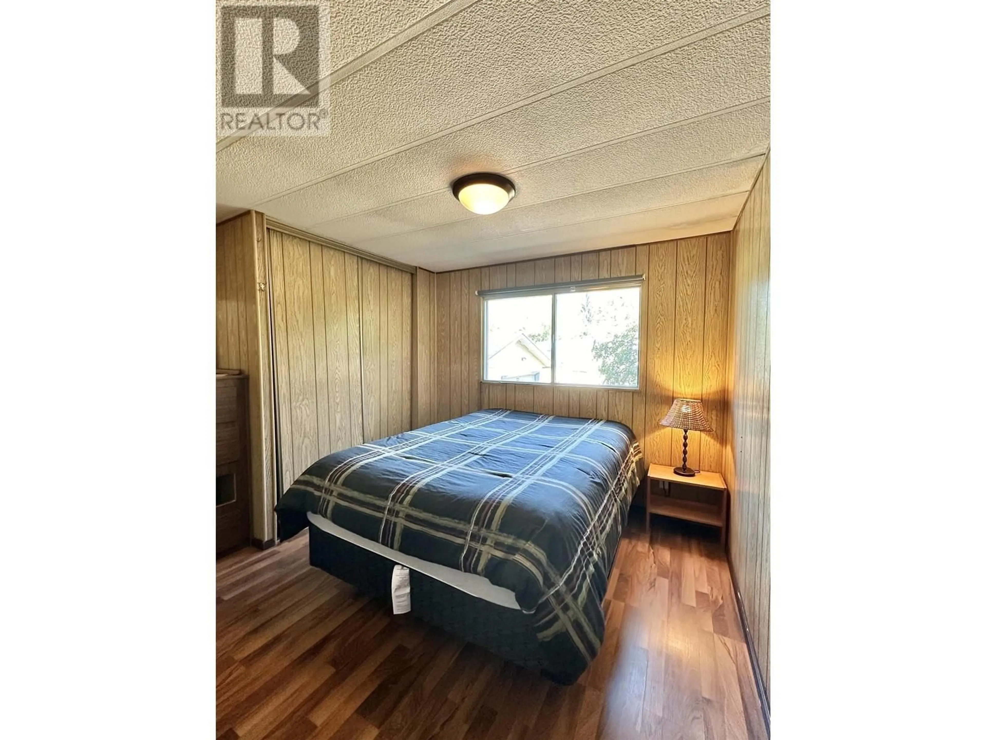 Bedroom with bed, wood/laminate floor for 1080 4TH AVENUE, Valemount British Columbia V0E2Z0