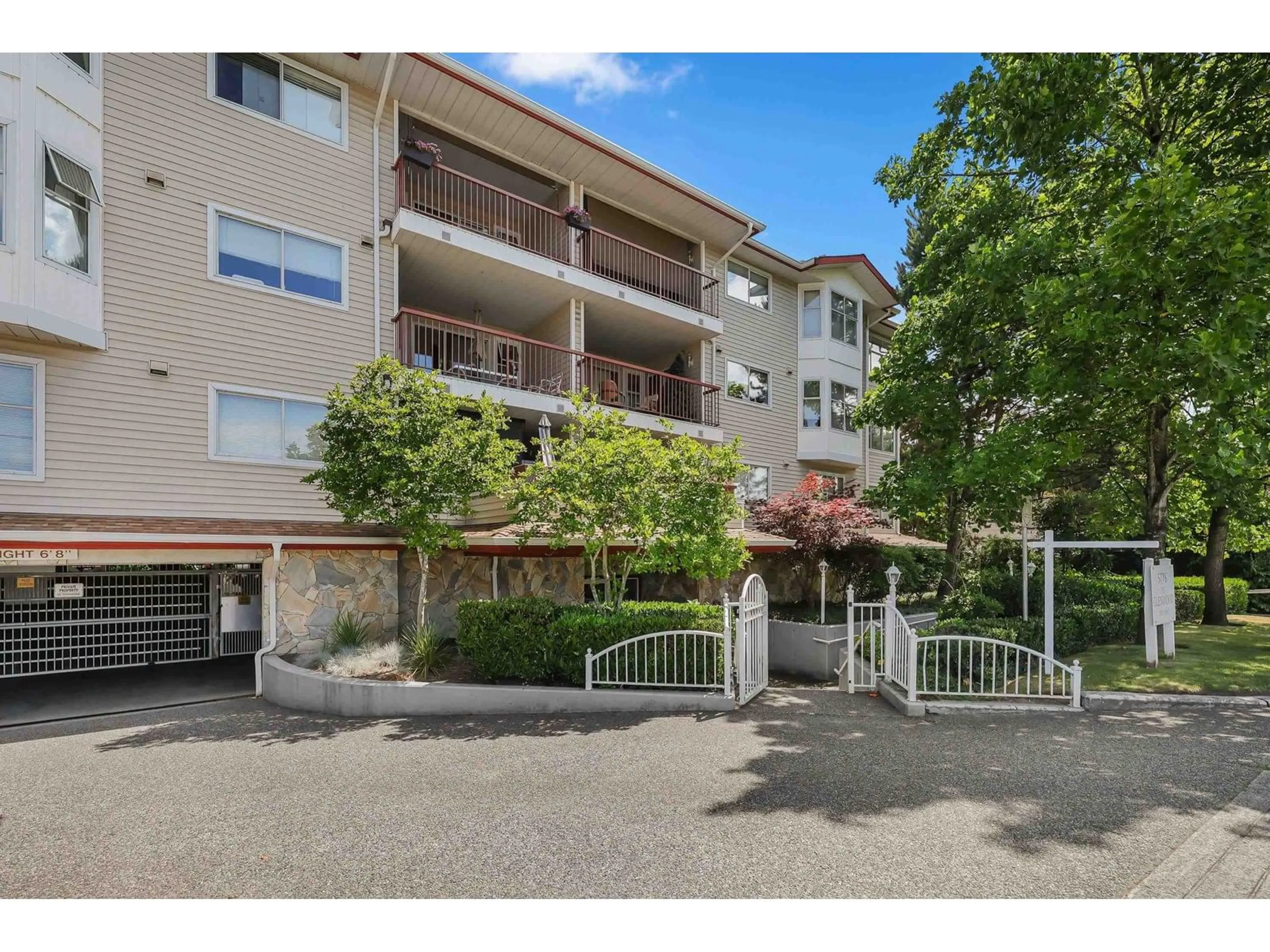 A pic from outside/outdoor area/front of a property/back of a property/a pic from drone, street for 106 - 5776 200, Langley British Columbia V3A1M8