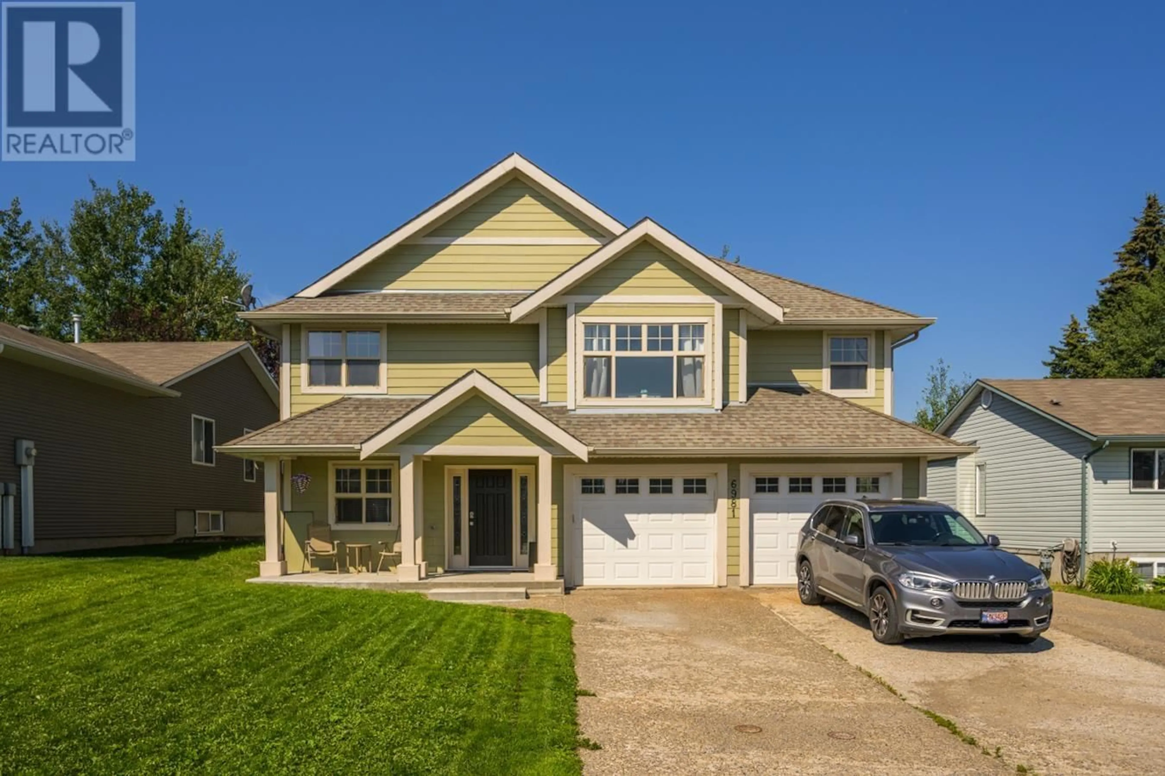 Home with vinyl exterior material, street for 6981 EUGENE ROAD, Prince George British Columbia V2N5P6