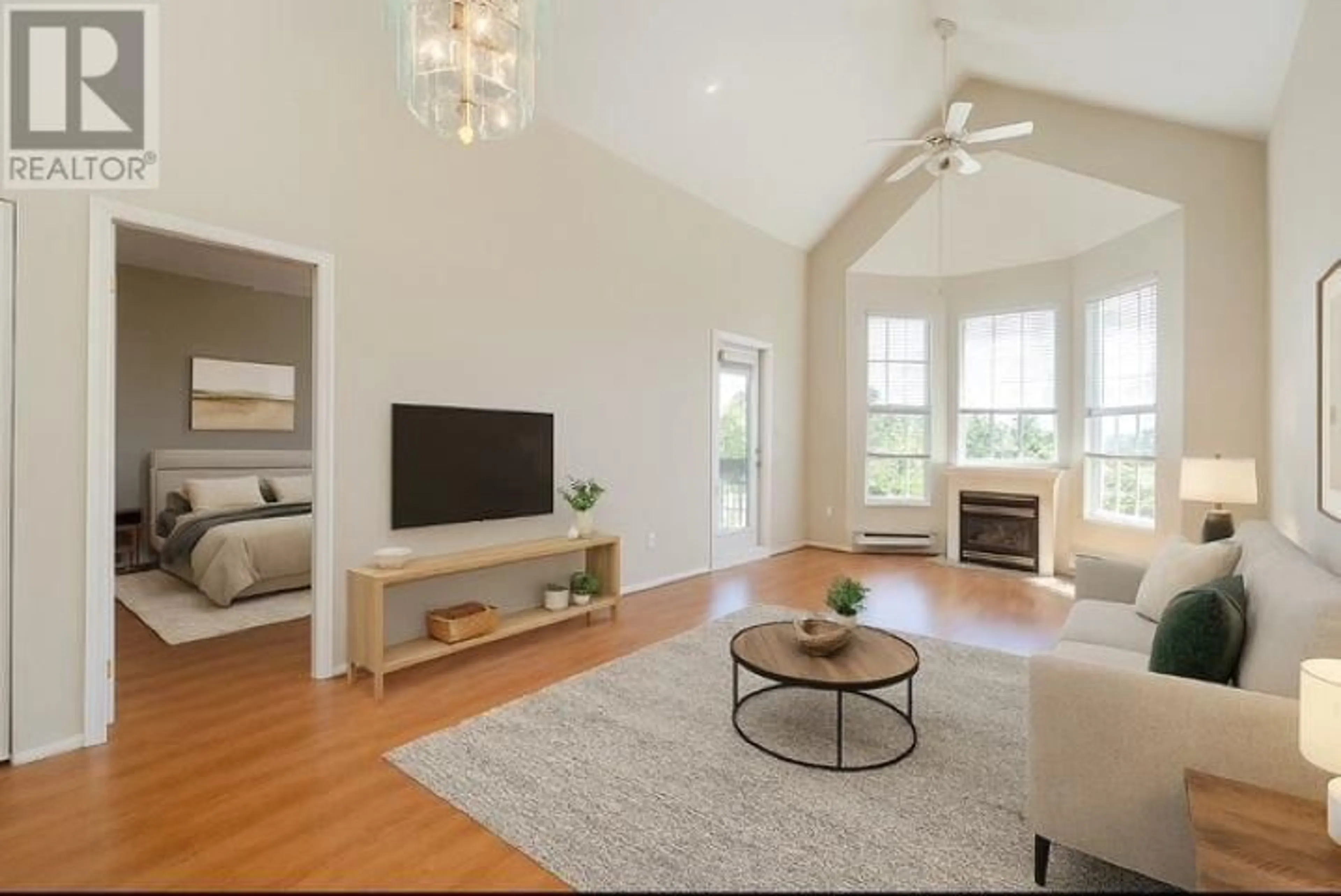 Living room with furniture, wood/laminate floor for 409 - 1369 56 STREET, Delta British Columbia V4L2A6