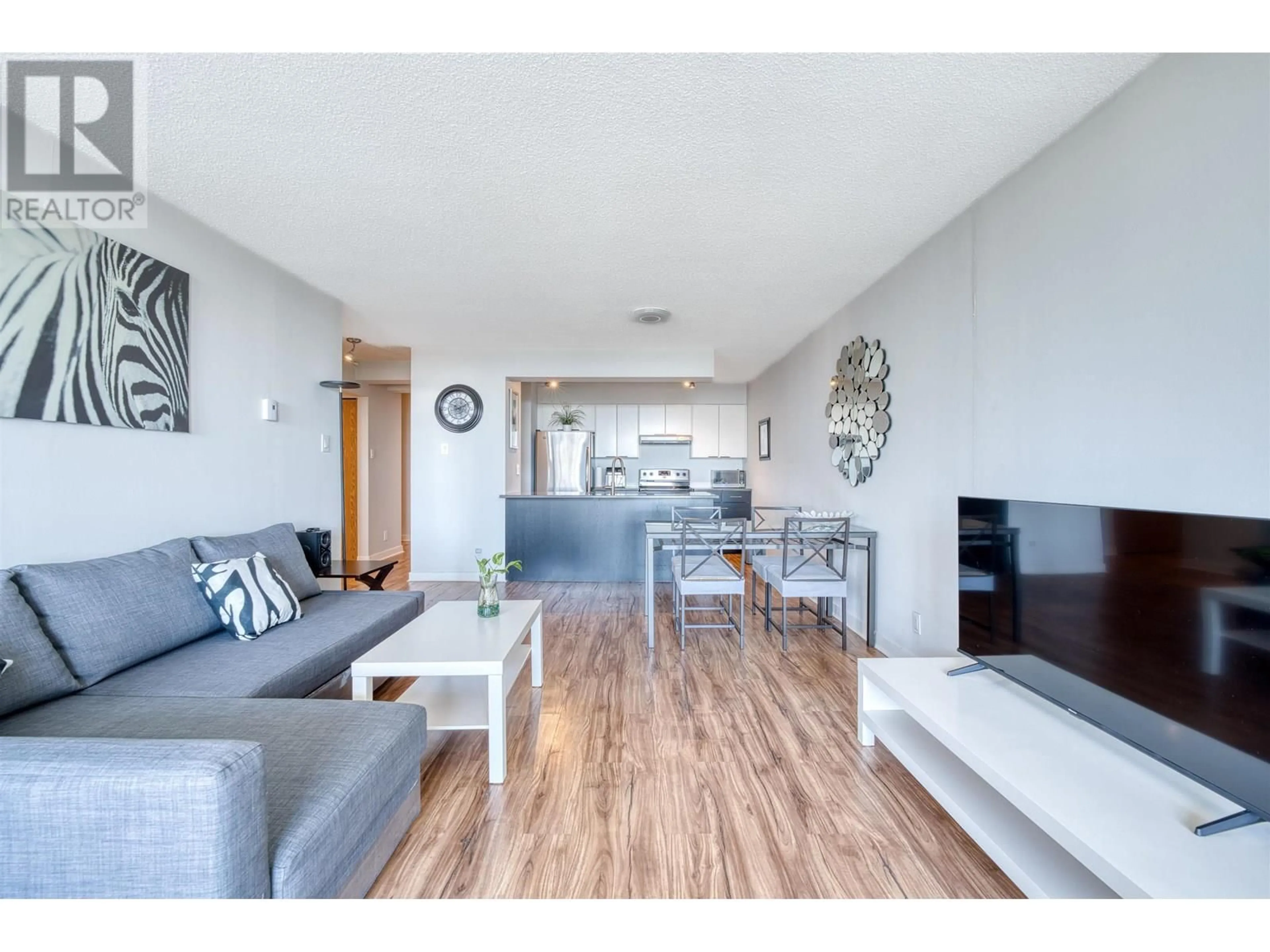 Living room with furniture, wood/laminate floor for 2201 - 9521 CARDSTON COURT, Burnaby British Columbia V3N4R8