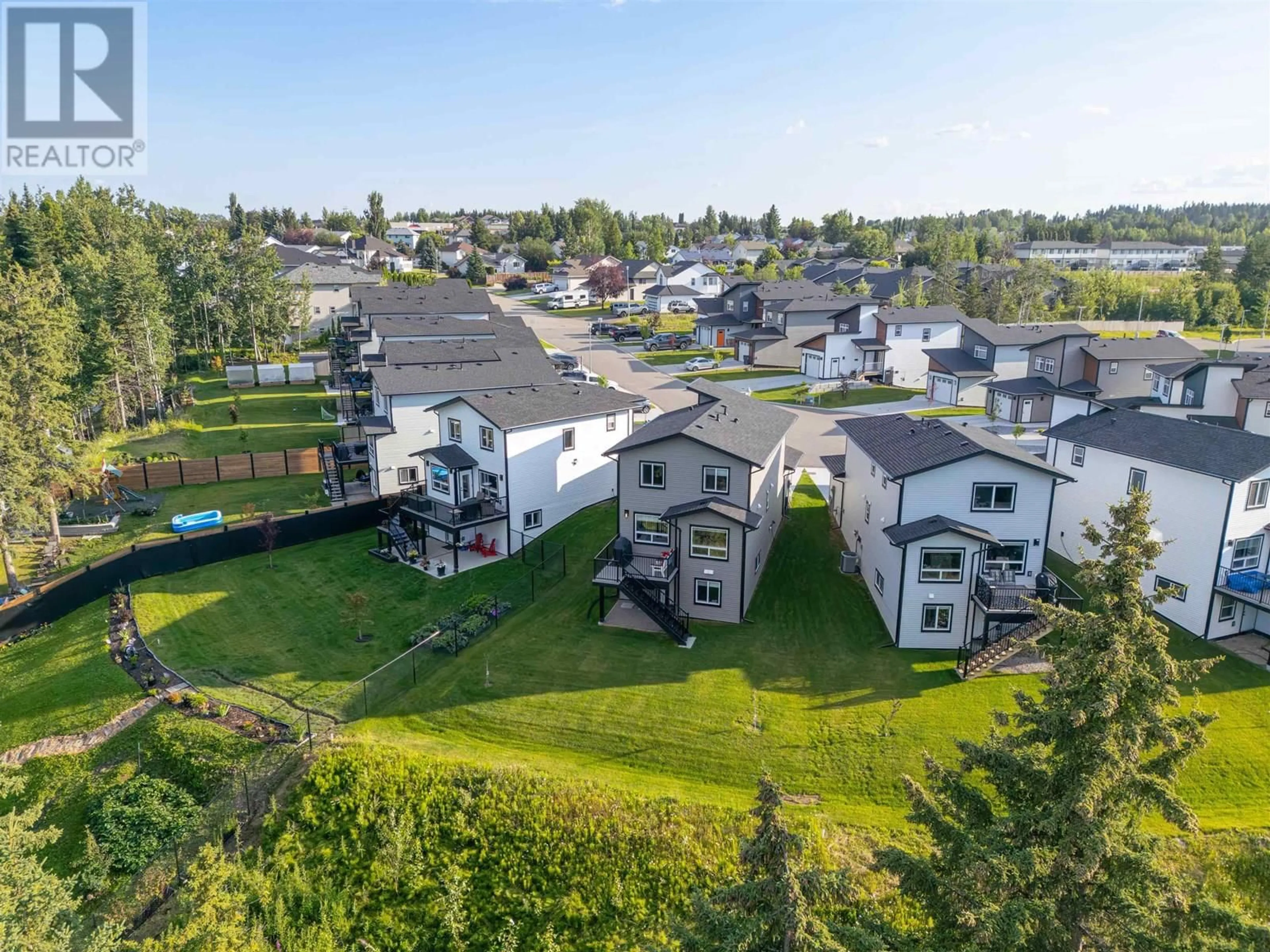 A pic from outside/outdoor area/front of a property/back of a property/a pic from drone, unknown for 114 - 6664 WESTMOUNT DRIVE, Prince George British Columbia V2N6R3
