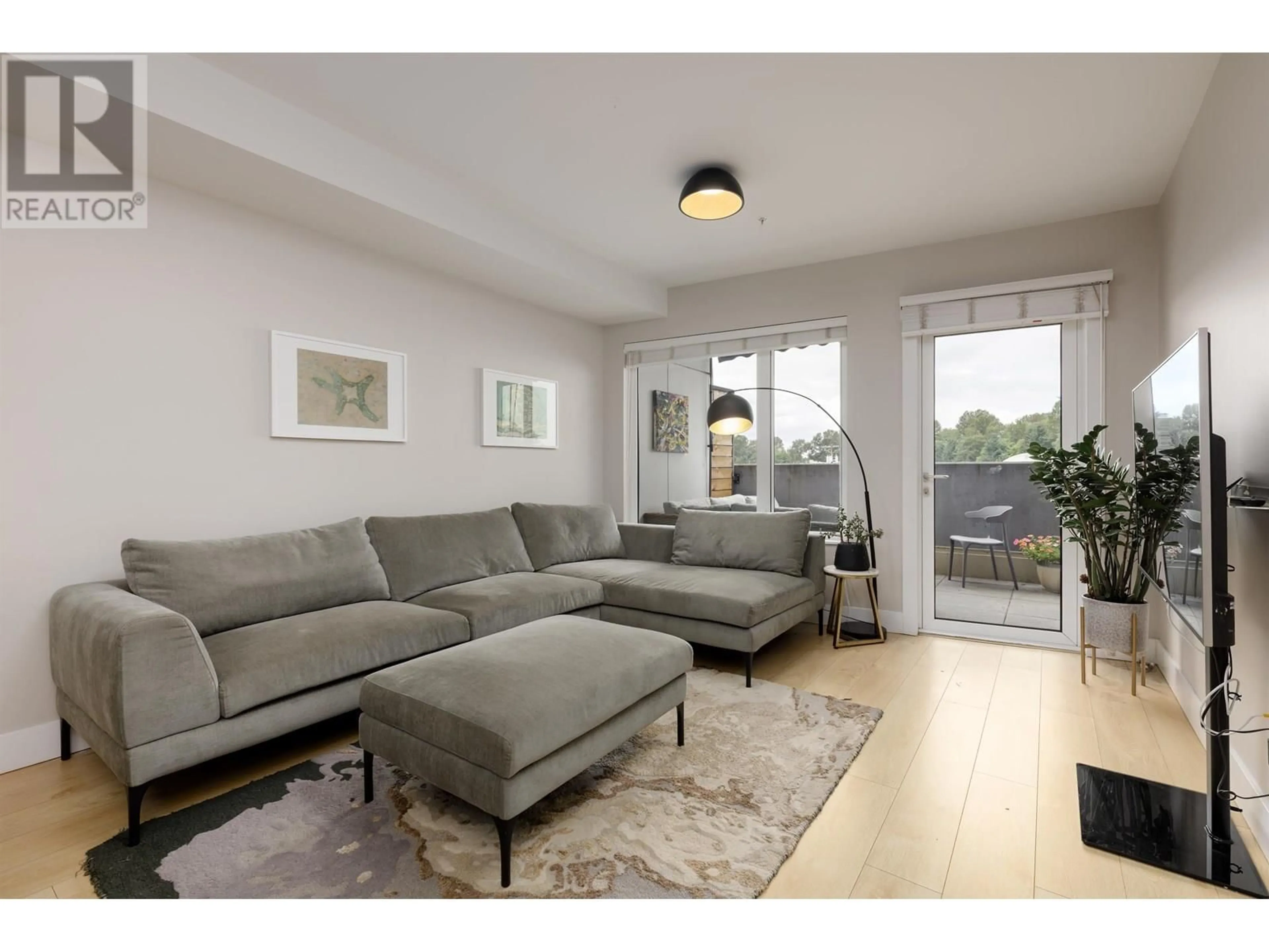 Living room with furniture, unknown for 202 - 1496 CHARLOTTE ROAD, North Vancouver British Columbia V7J0C9