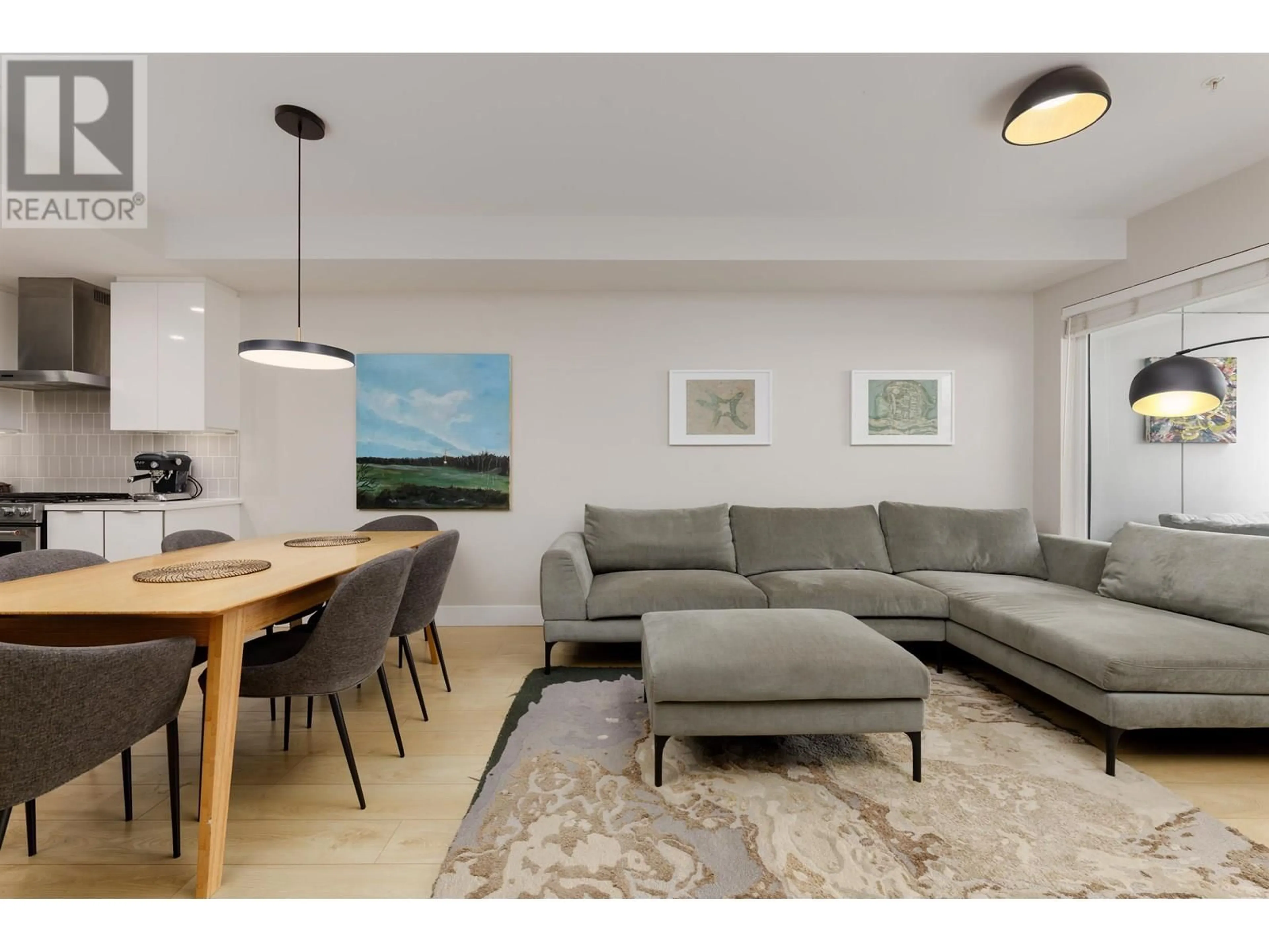 Living room with furniture, wood/laminate floor for 202 - 1496 CHARLOTTE ROAD, North Vancouver British Columbia V7J0C9
