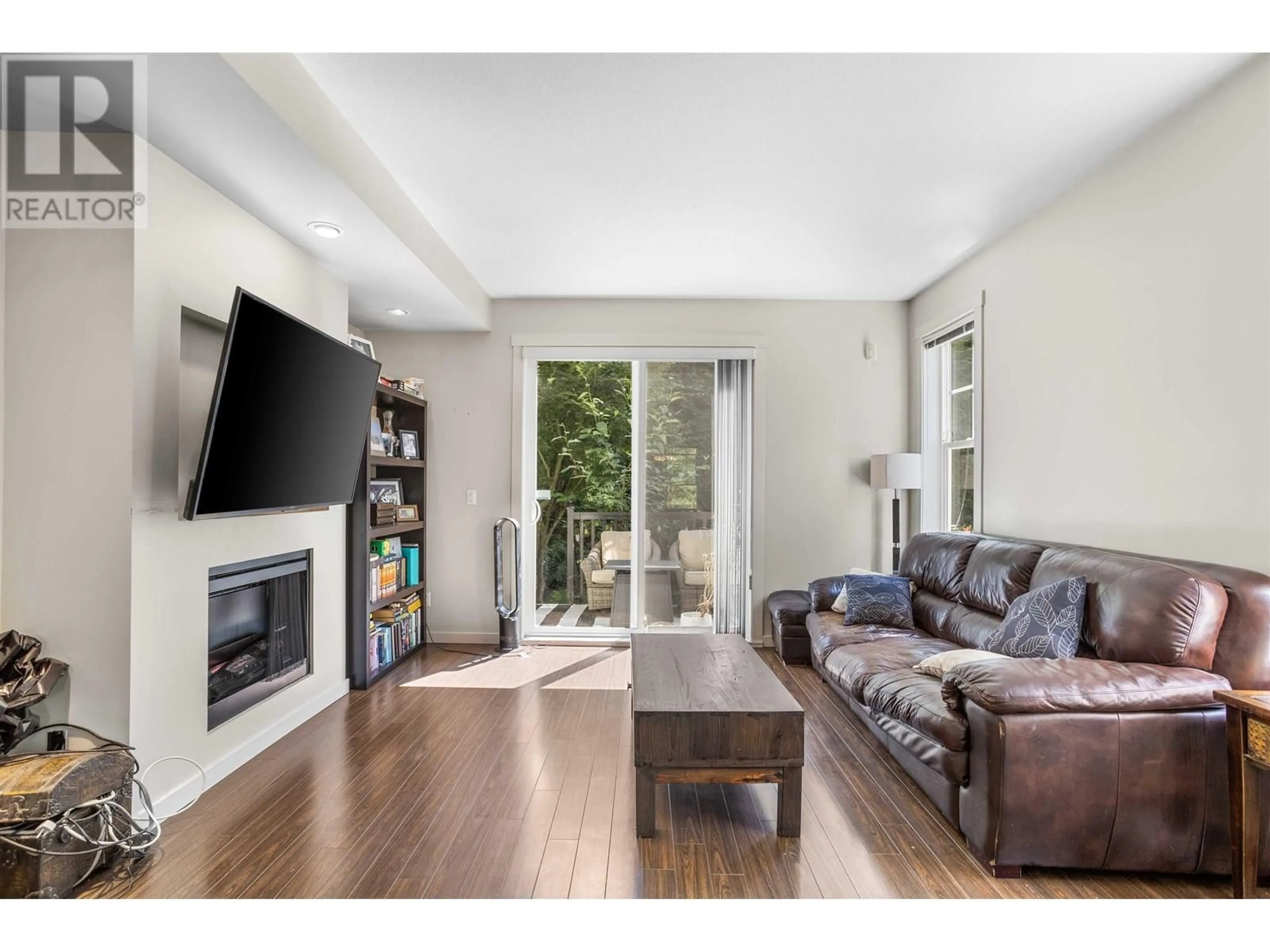 Living room with furniture, wood/laminate floor for 32 - 102 FRASER STREET, Port Moody British Columbia V3H0C7