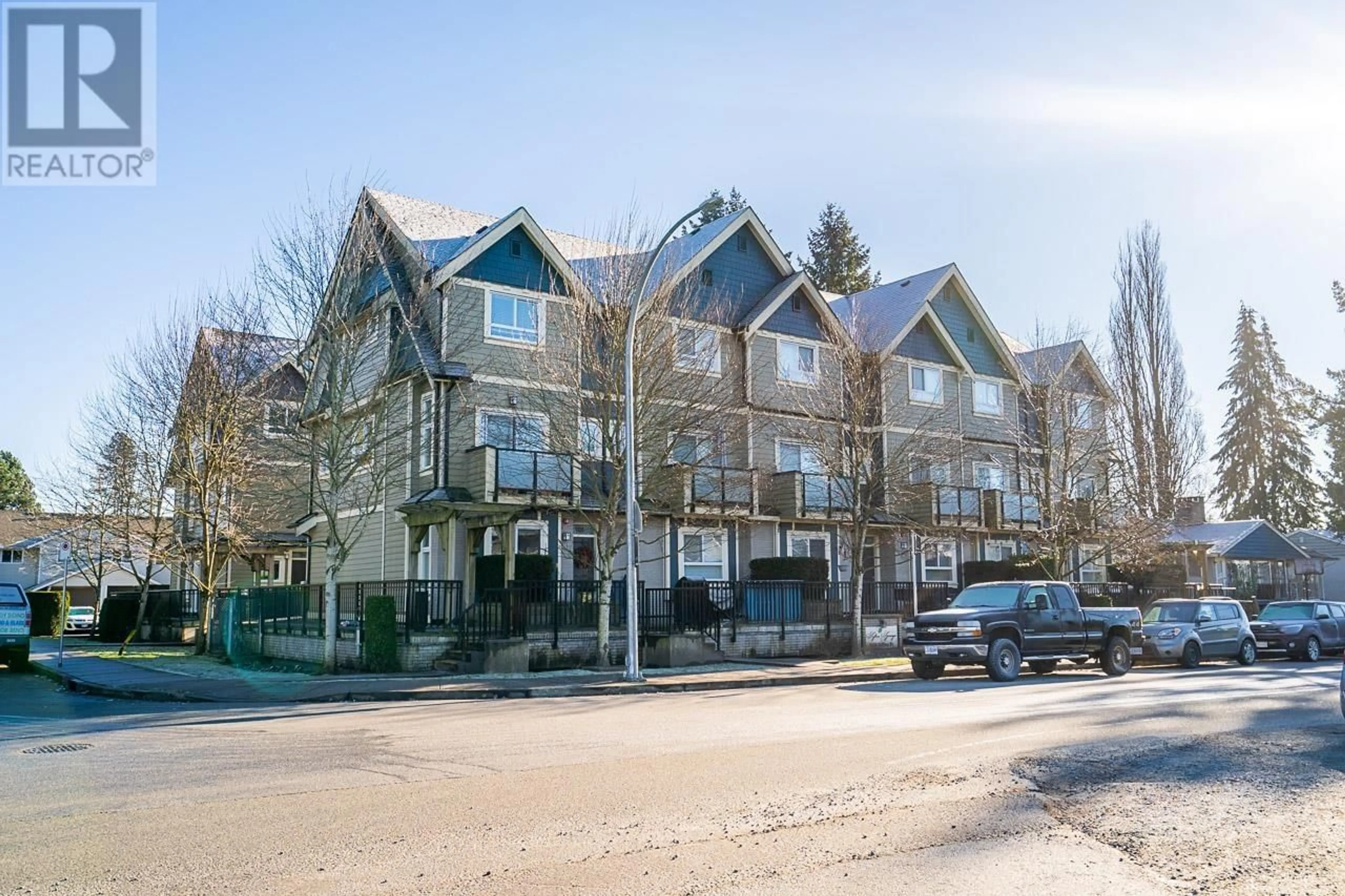 A pic from outside/outdoor area/front of a property/back of a property/a pic from drone, street for 104 - 3488 SEFTON STREET, Port Coquitlam British Columbia V3B3R2