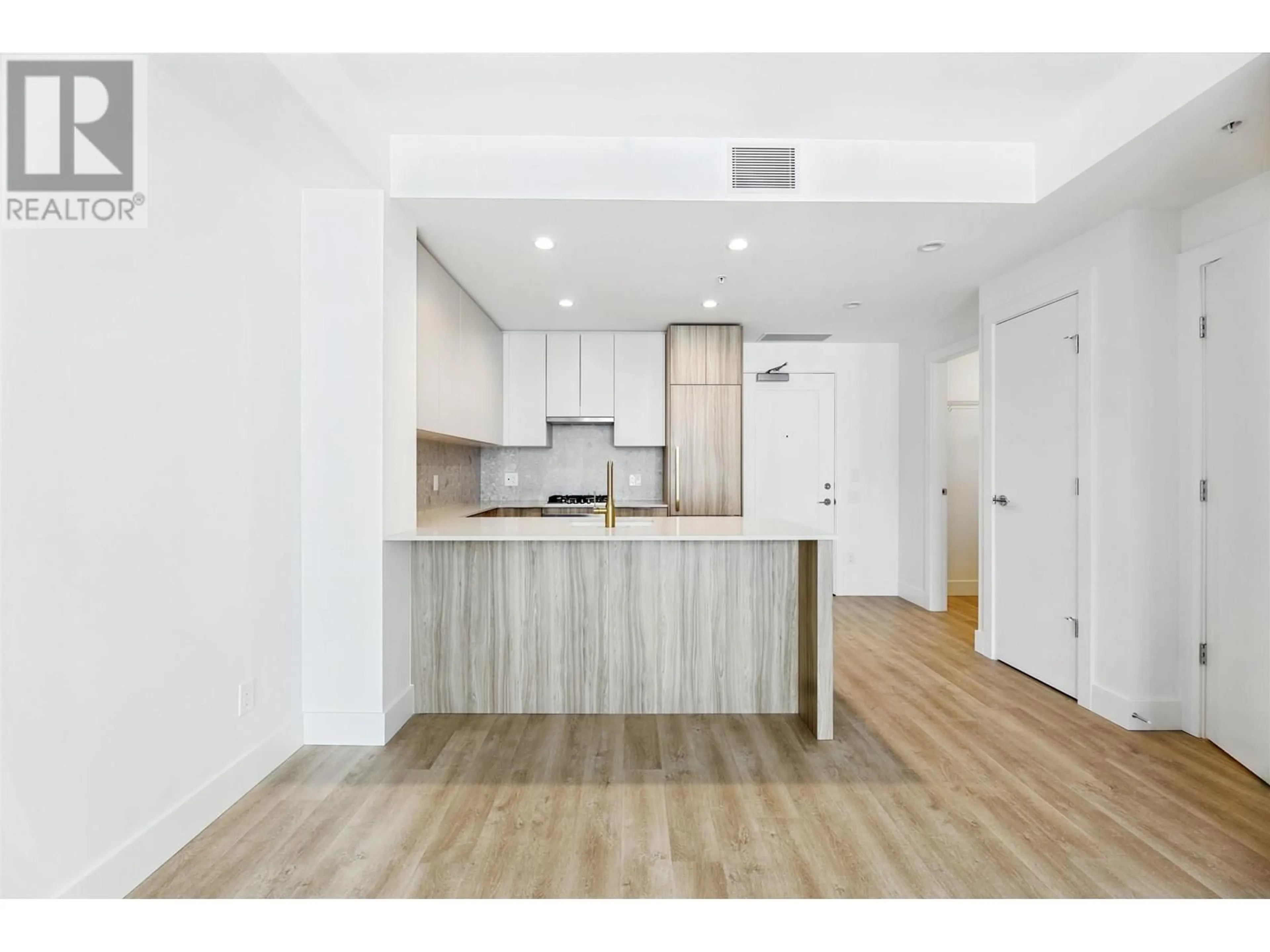 Open concept kitchen, wood/laminate floor for 605 - 2385 EMERY COURT, North Vancouver British Columbia V7J0G1