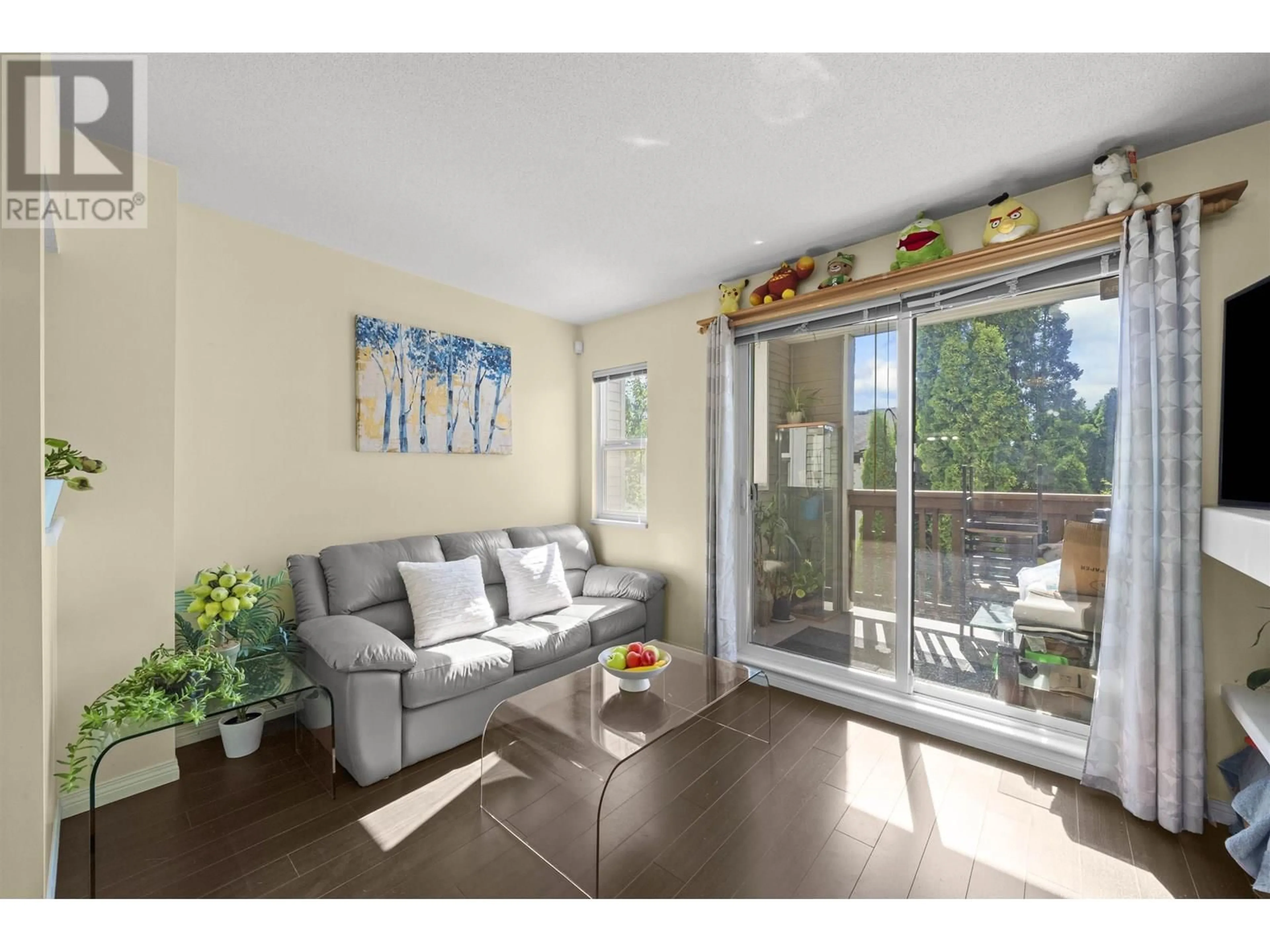 Living room with furniture, wood/laminate floor for 3 - 7111 LYNNWOOD DRIVE, Richmond British Columbia V7C5S9