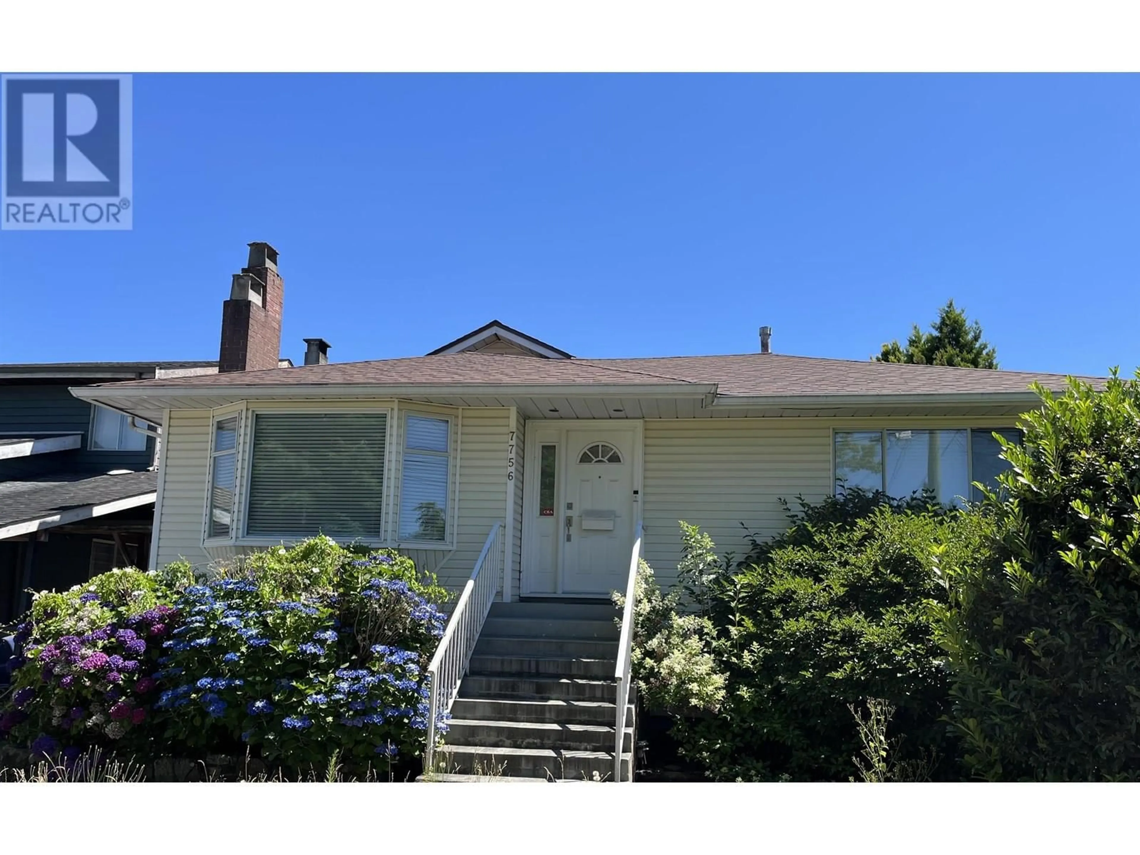 Home with vinyl exterior material, street for 7756 GOODLAD STREET, Burnaby British Columbia V5E2H6