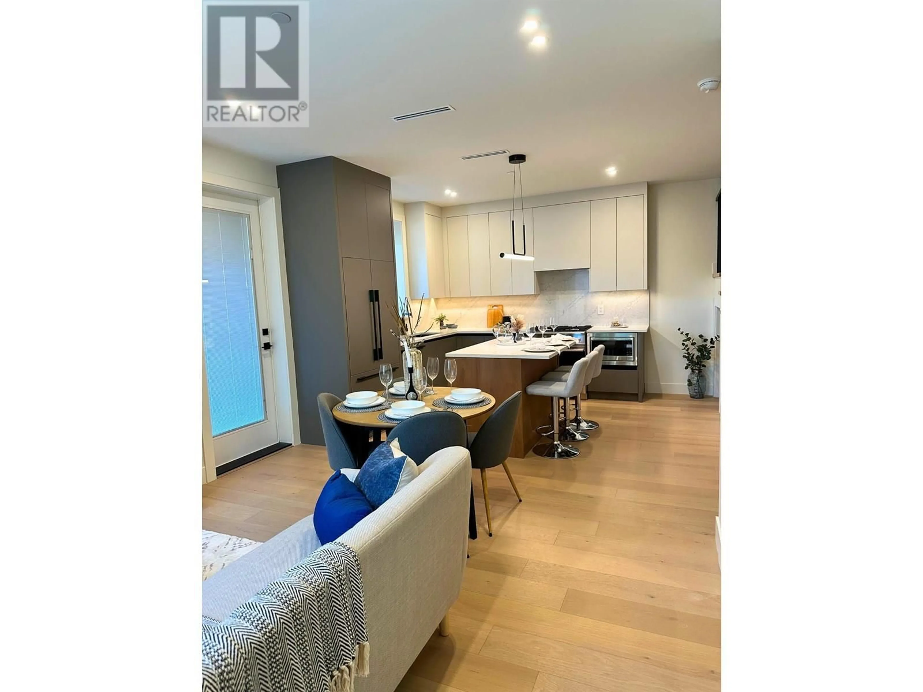 Open concept kitchen, wood/laminate floor for 3483 ADANAC STREET, Vancouver British Columbia V5K4P4
