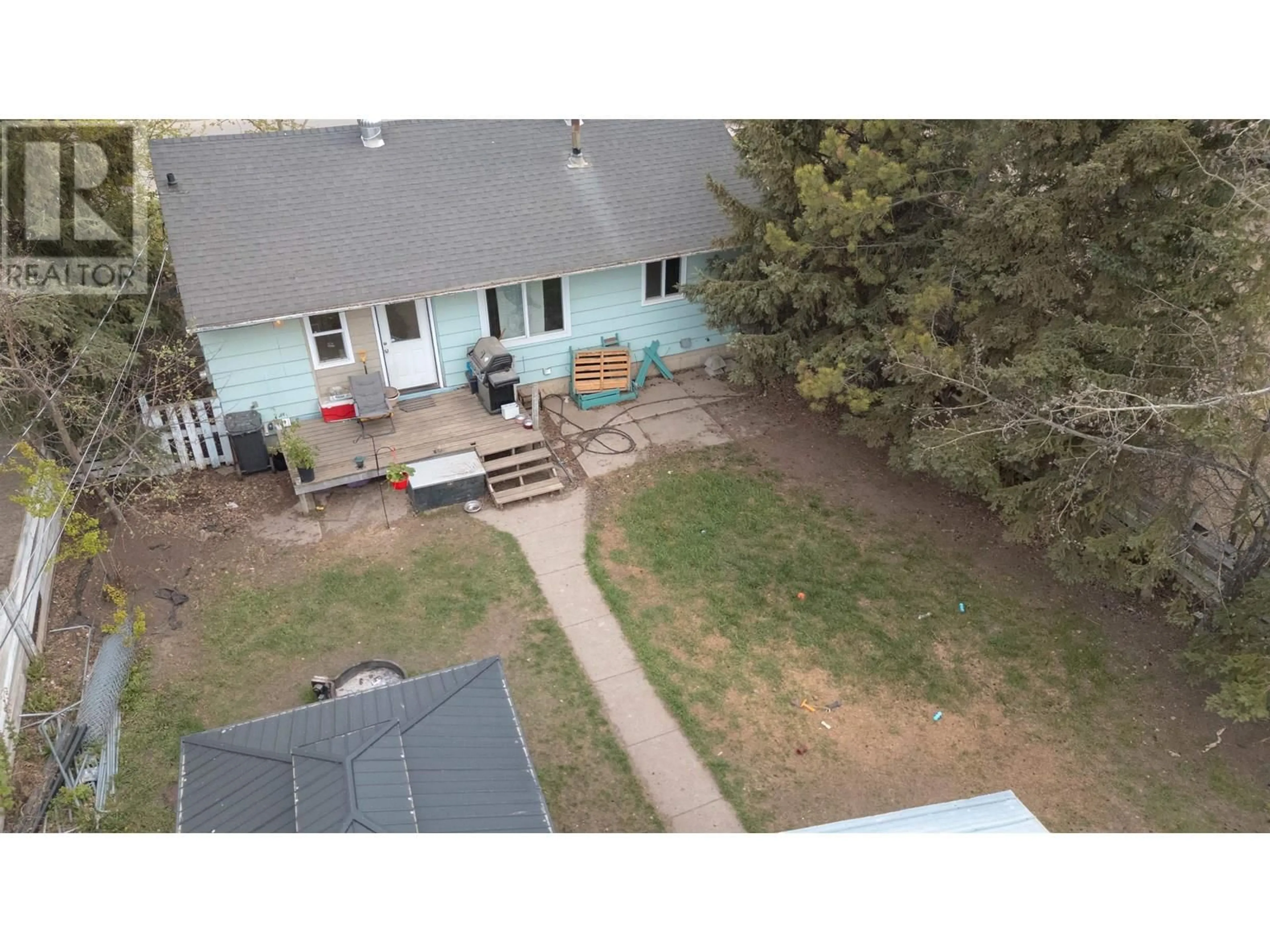 A pic from outside/outdoor area/front of a property/back of a property/a pic from drone, unknown for 9812 102 AVENUE, Fort St. John British Columbia V1J2E1
