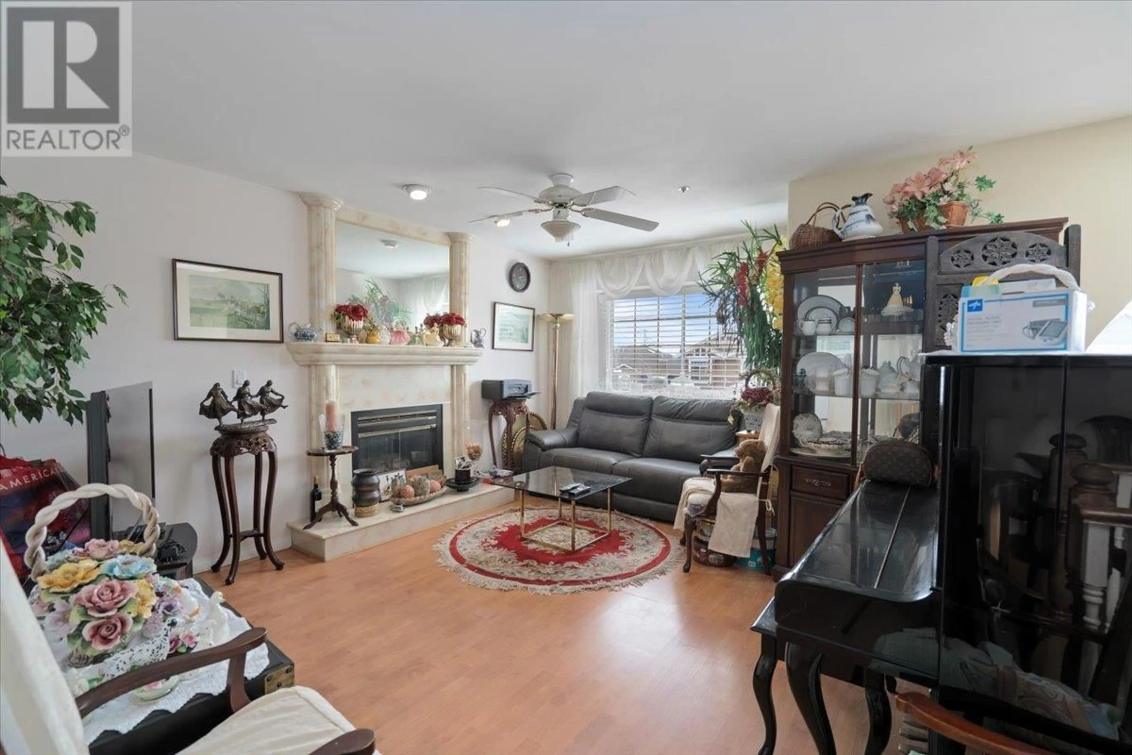 Living room with furniture, ceramic/tile floor for 7138 FRASER STREET, Vancouver British Columbia V5X3V7