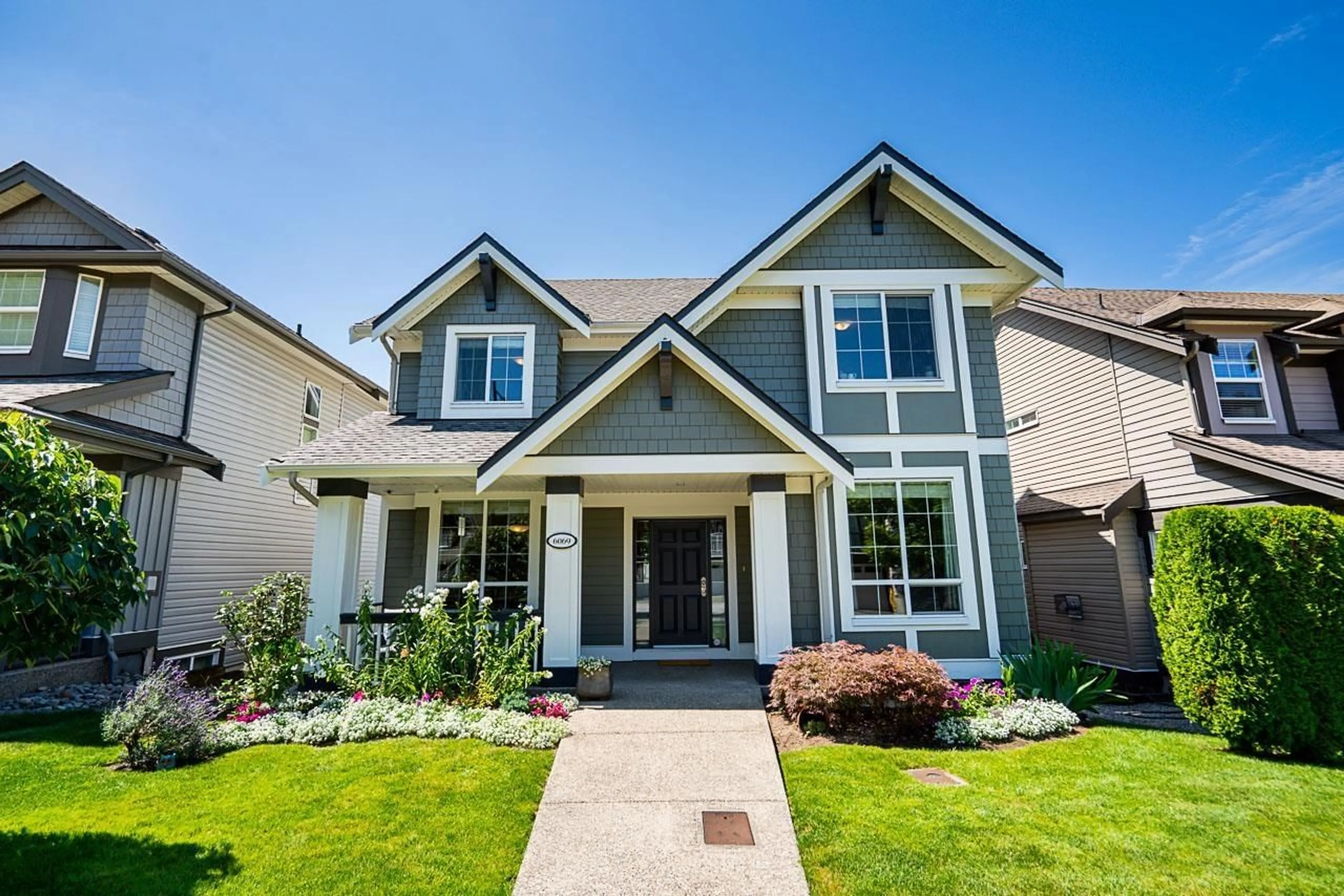 Home with vinyl exterior material, street for 6069 163B, Surrey British Columbia V3S2H7