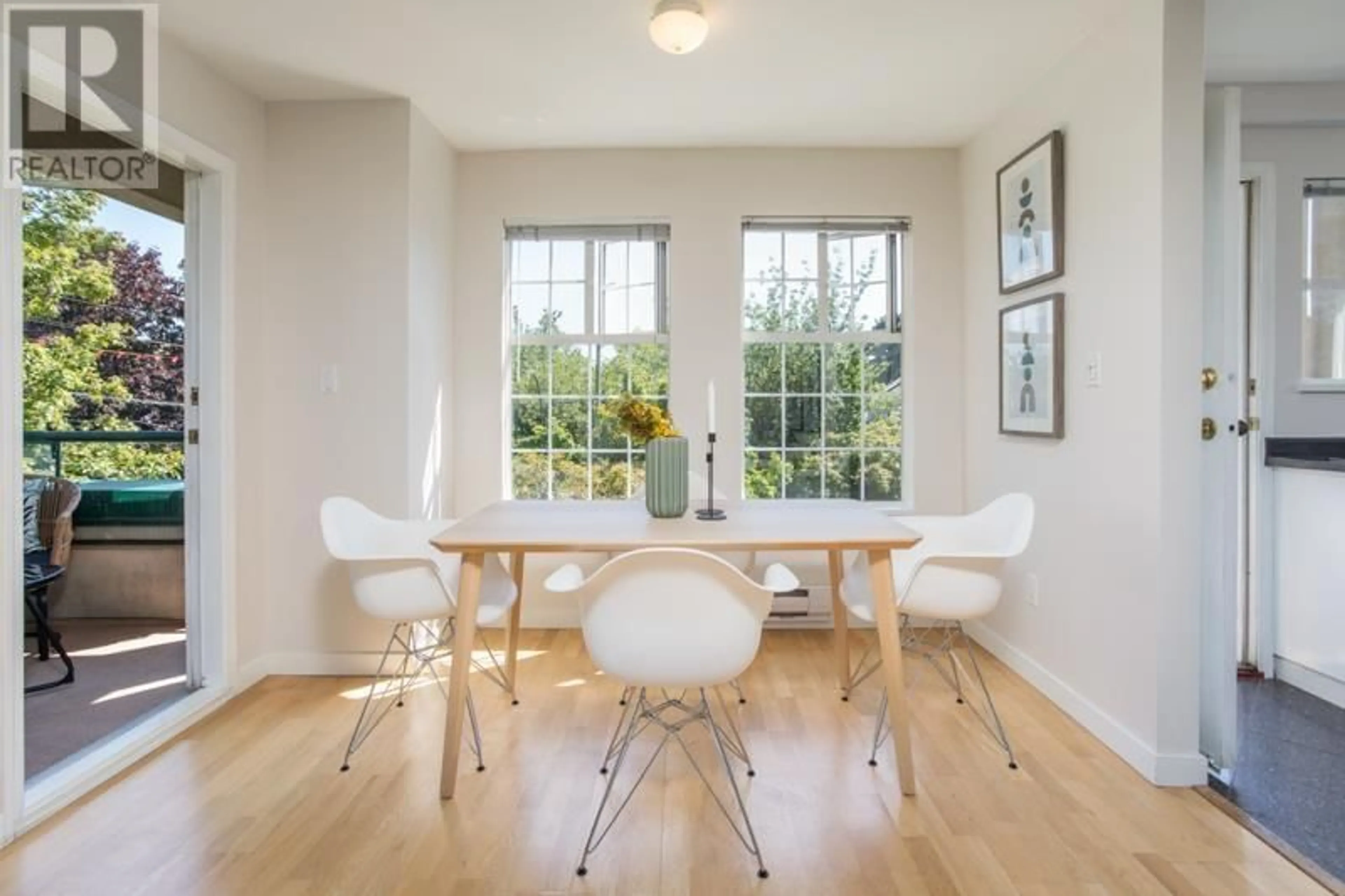 Dining room, wood/laminate floor for 301 - 2091 VINE STREET, Vancouver British Columbia V6K4P7