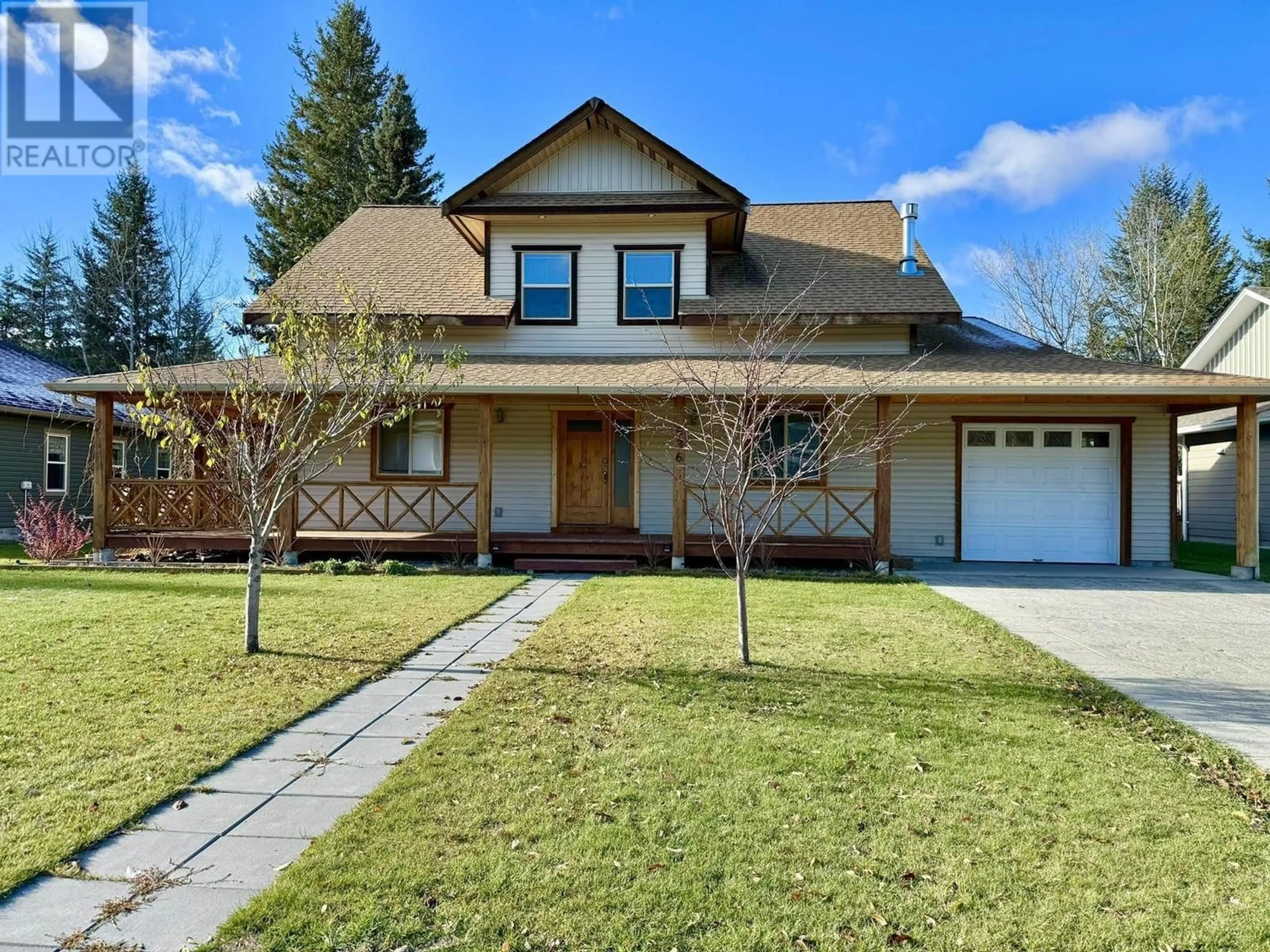 Home with vinyl exterior material, street for 936 FRASER AVENUE, 100 Mile House British Columbia V0K2E0