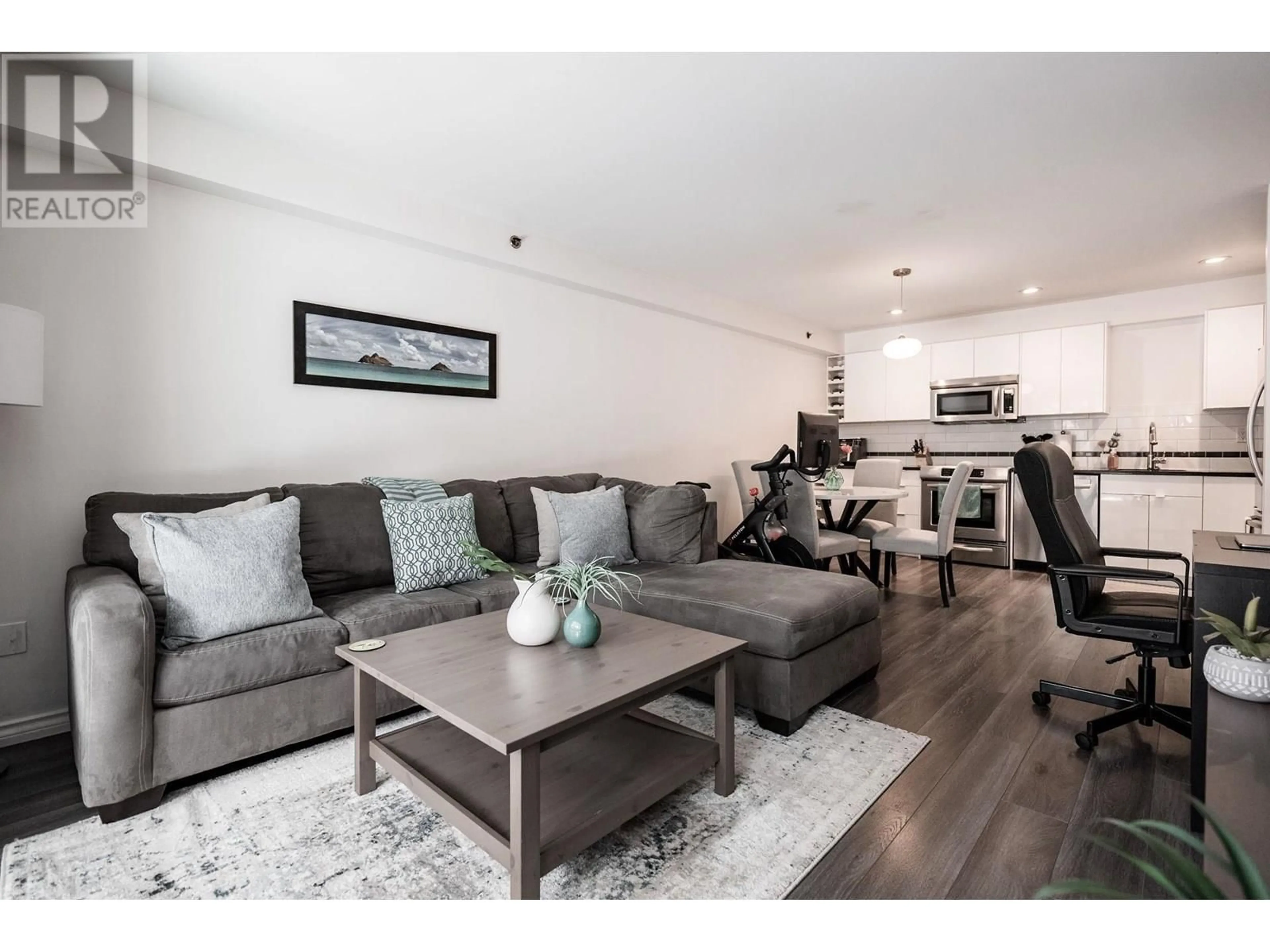 Living room with furniture, wood/laminate floor for 106 - 825 7TH AVENUE, Vancouver British Columbia V5T1P4