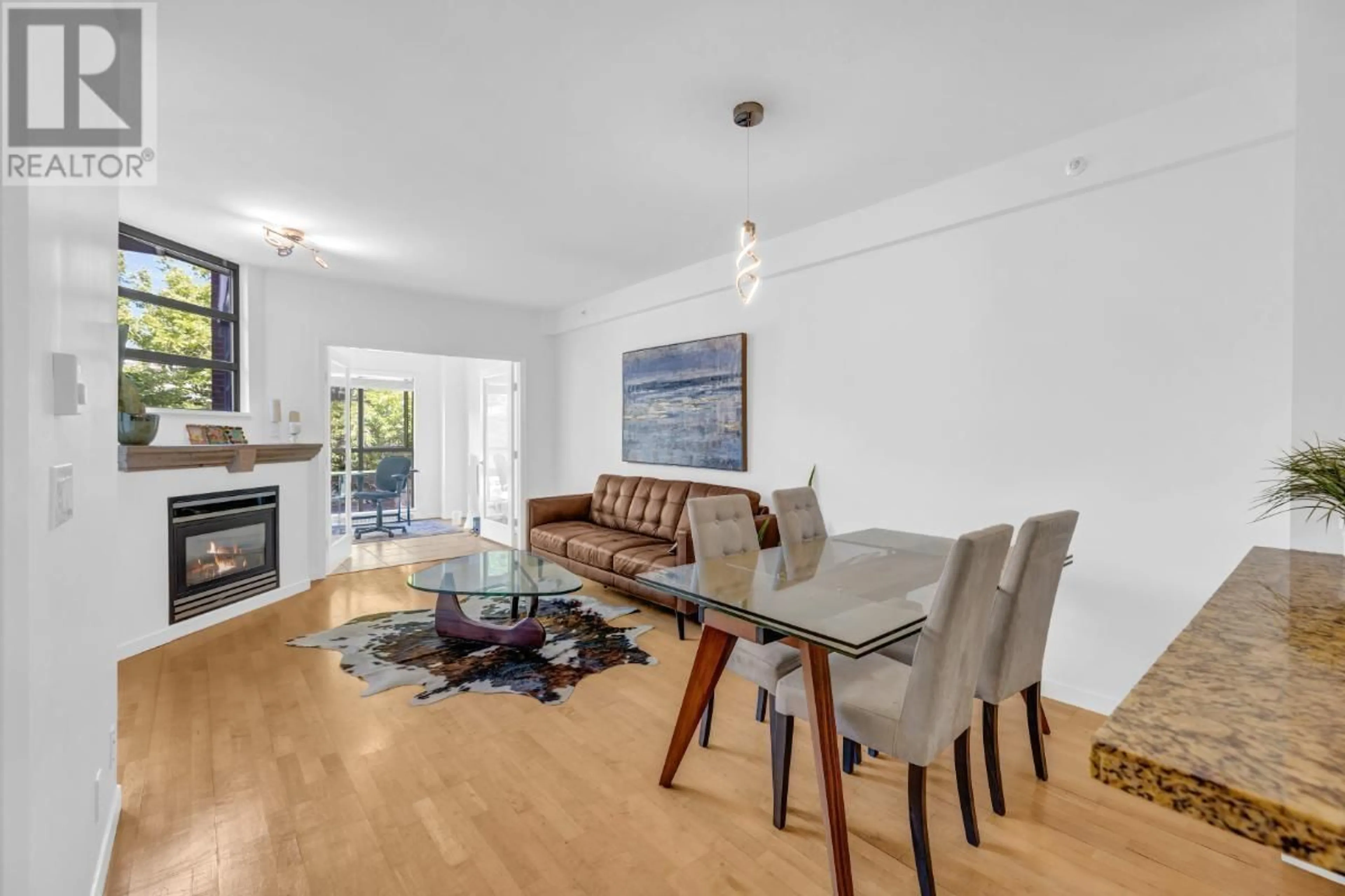 Living room with furniture, wood/laminate floor for 209 - 2228 MARSTRAND AVENUE, Vancouver British Columbia V6K4T1