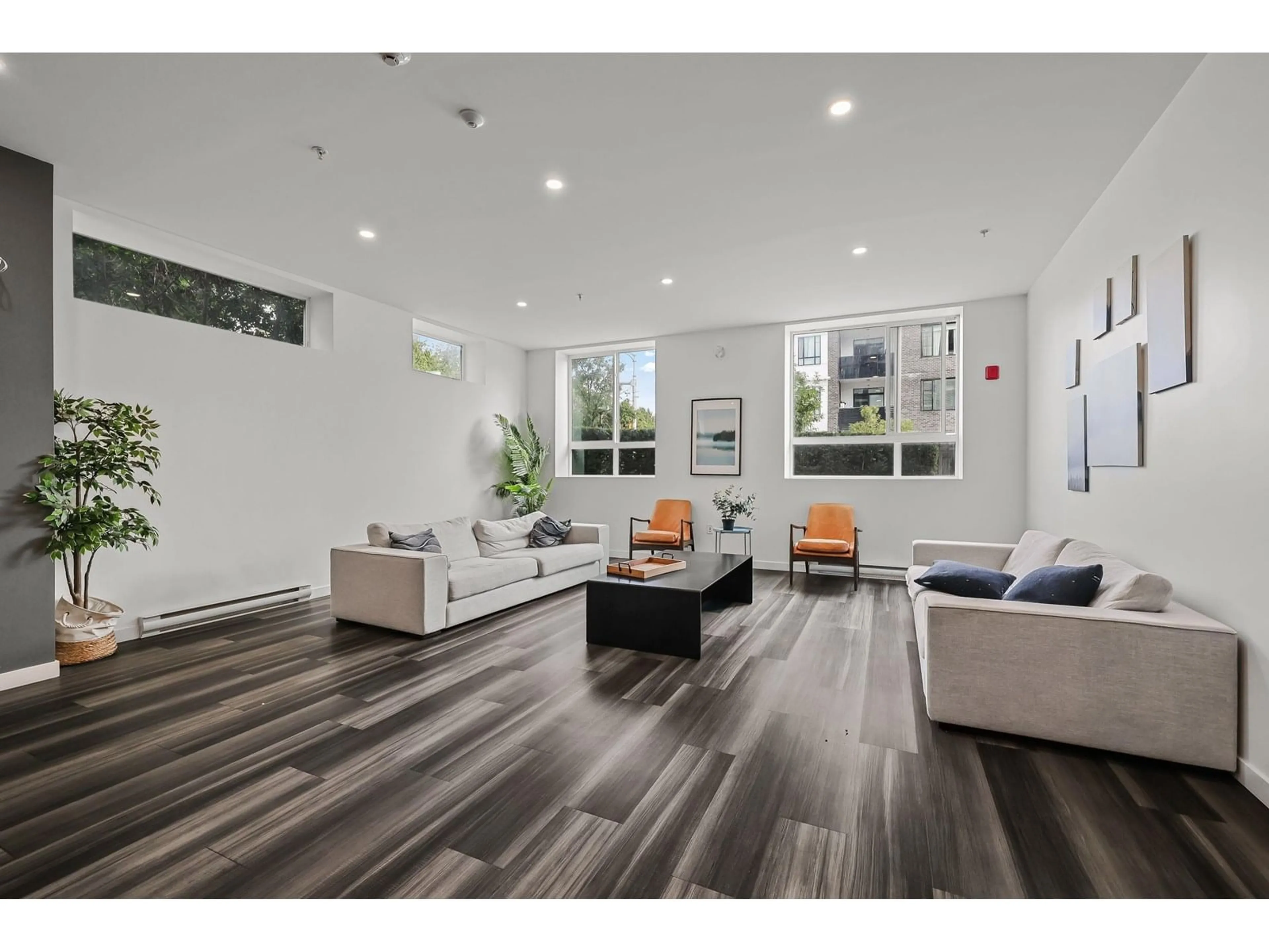 Living room with furniture, wood/laminate floor for 303 - 13628 81A, Surrey British Columbia V3W3E2