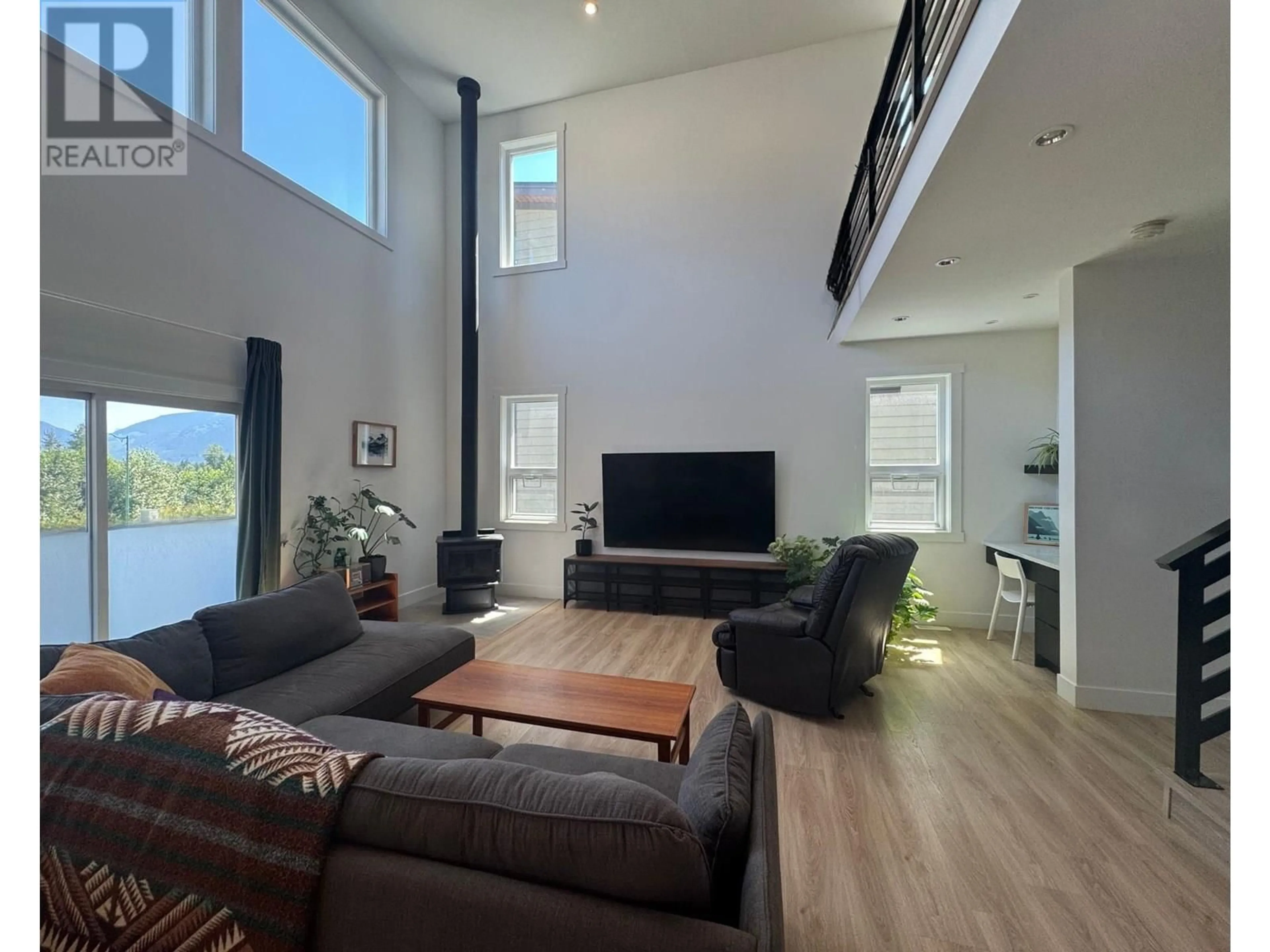 Living room with furniture, wood/laminate floor for 2043 TIYATA BOULEVARD, Pemberton British Columbia V0N2L0