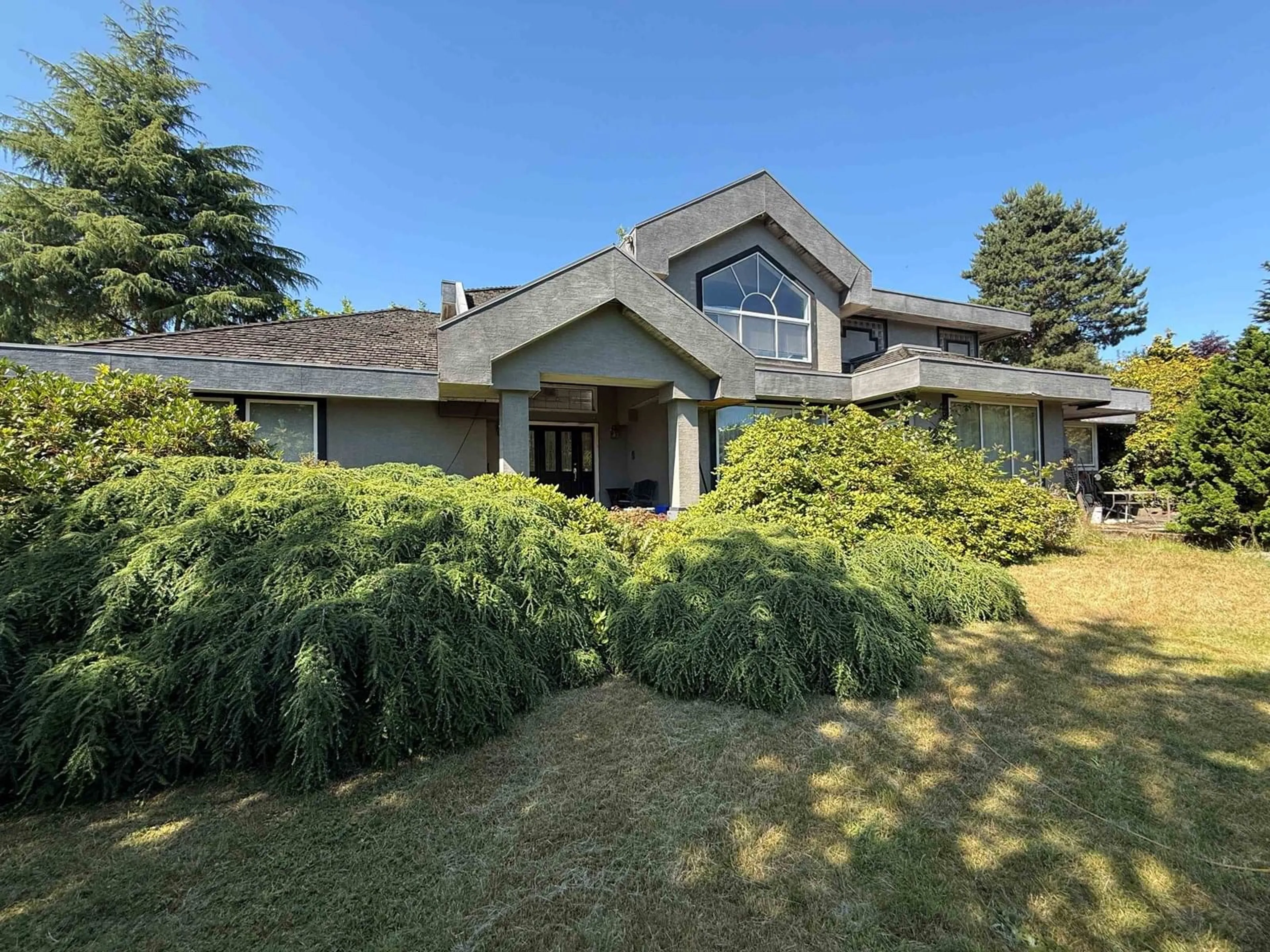A pic from outside/outdoor area/front of a property/back of a property/a pic from drone, unknown for 7722 163RD, Surrey British Columbia V4N0L1