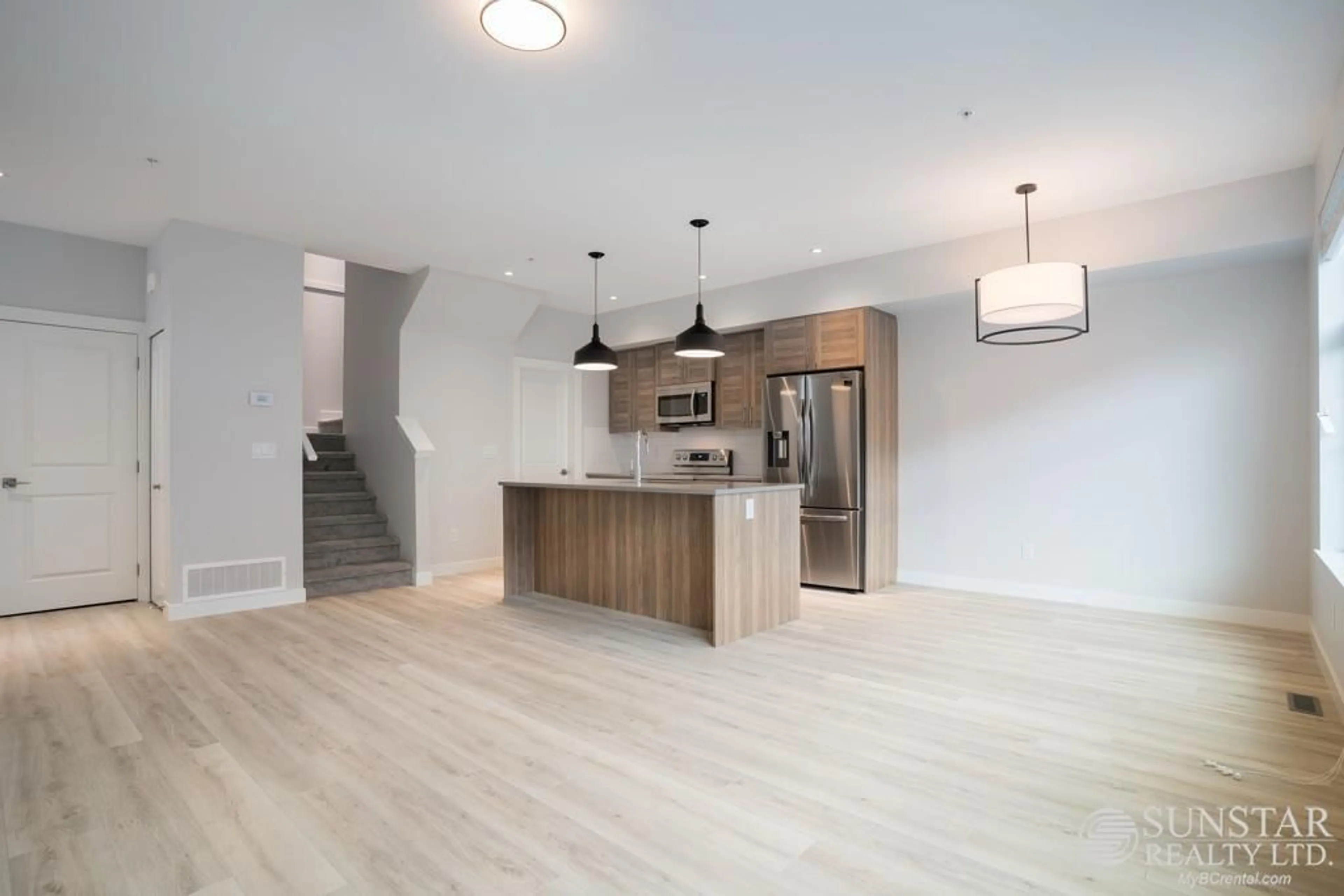 Open concept kitchen, wood/laminate floor for 37 - 8371 202B, Langley British Columbia V2Y4K6
