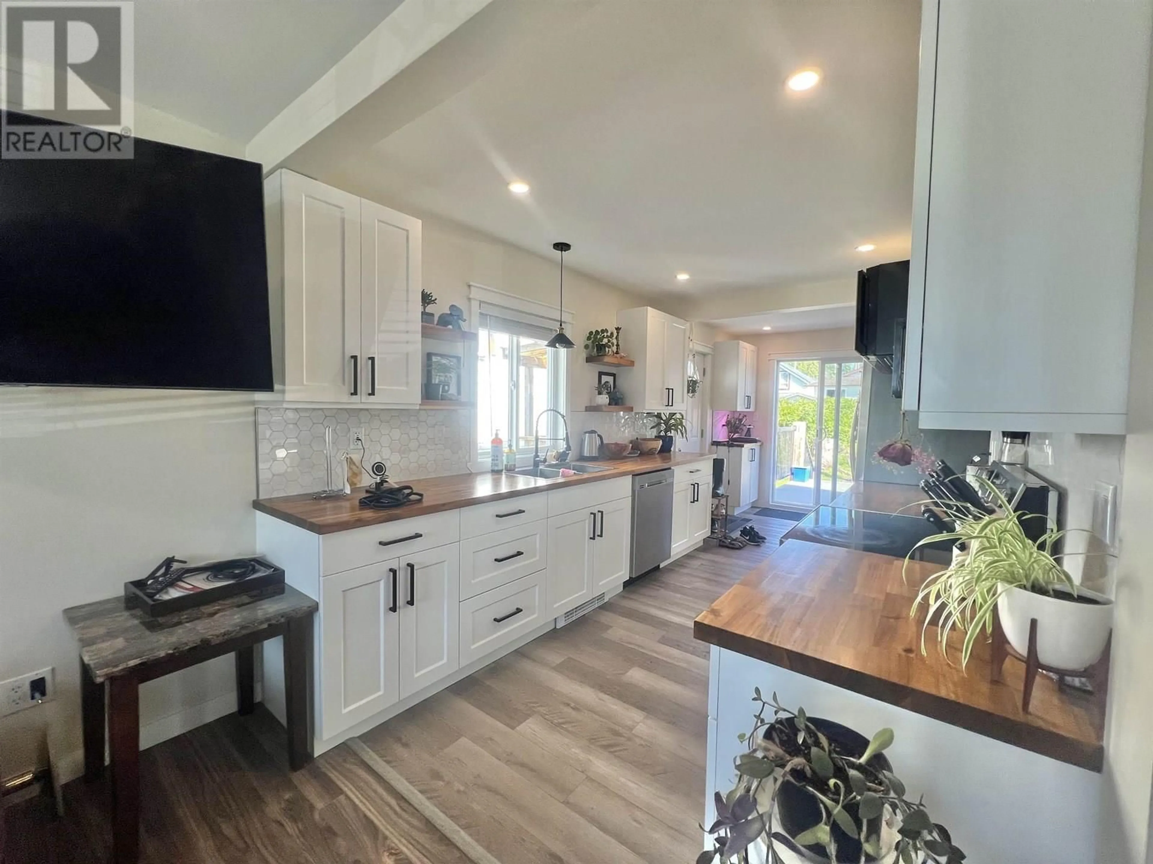 Open concept kitchen, wood/laminate floor for 1068 7 AVENUE, Prince Rupert British Columbia V8J4M9