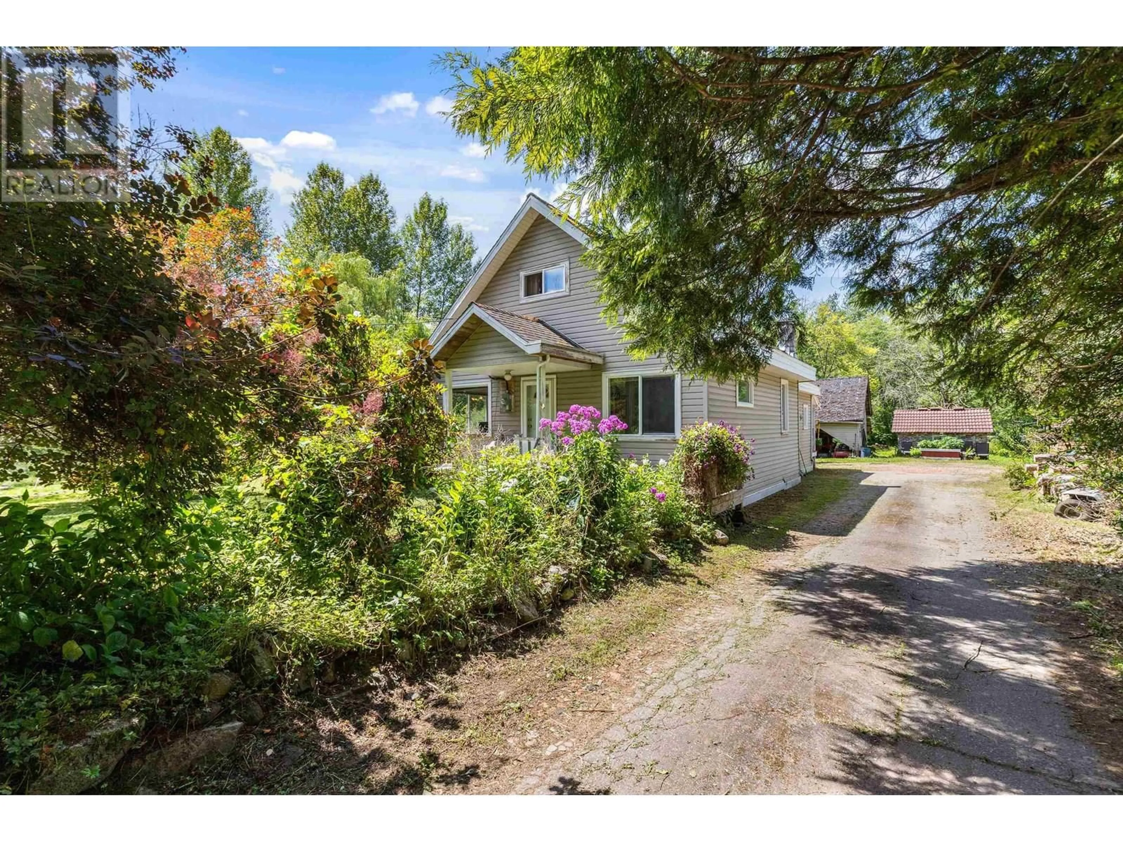 A pic from outside/outdoor area/front of a property/back of a property/a pic from drone, street for 12465 248 STREET, Maple Ridge British Columbia V4R1K4