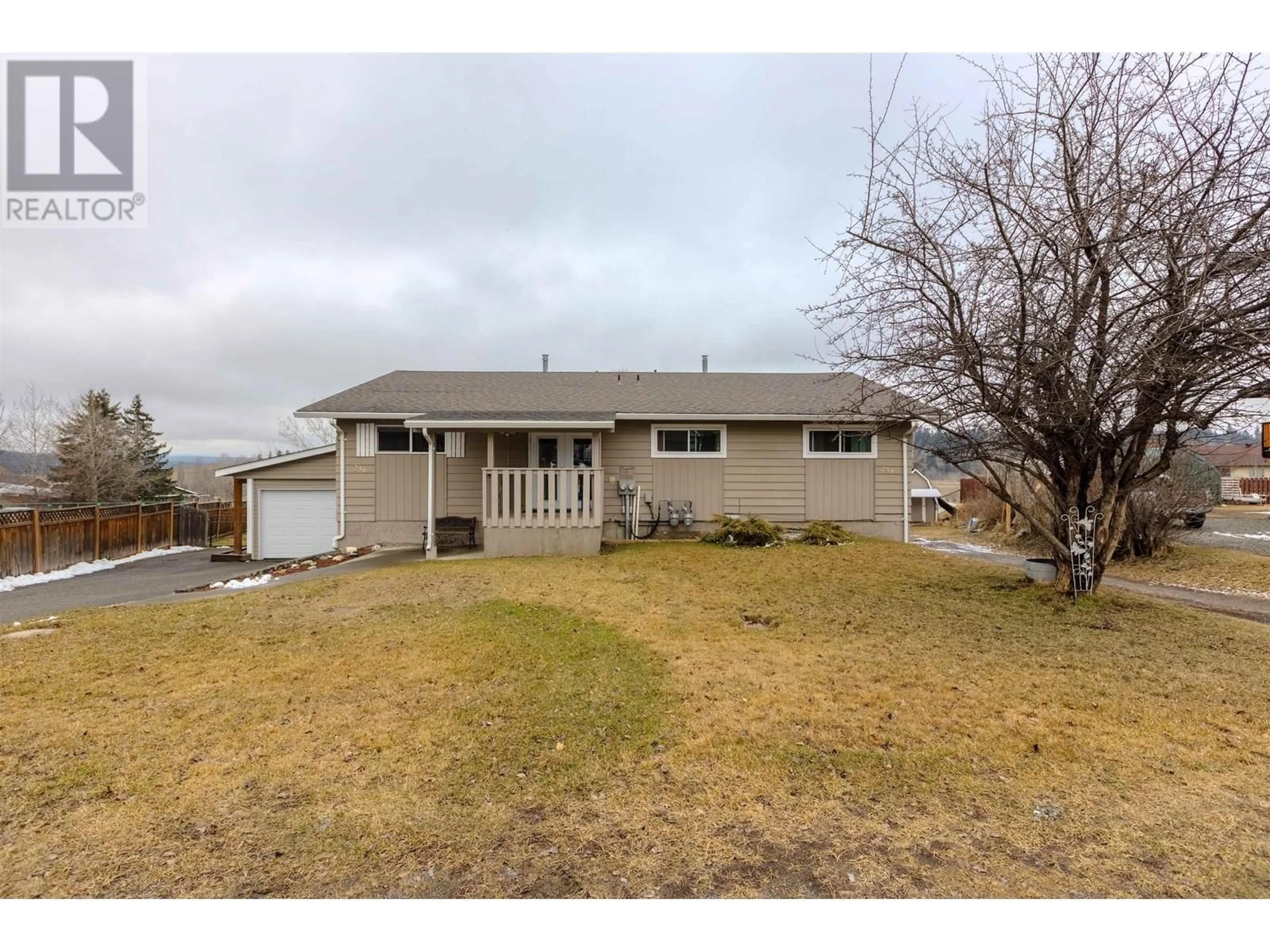 A pic from outside/outdoor area/front of a property/back of a property/a pic from drone, street for 238 ELM AVENUE, 100 Mile House British Columbia V0K2E0
