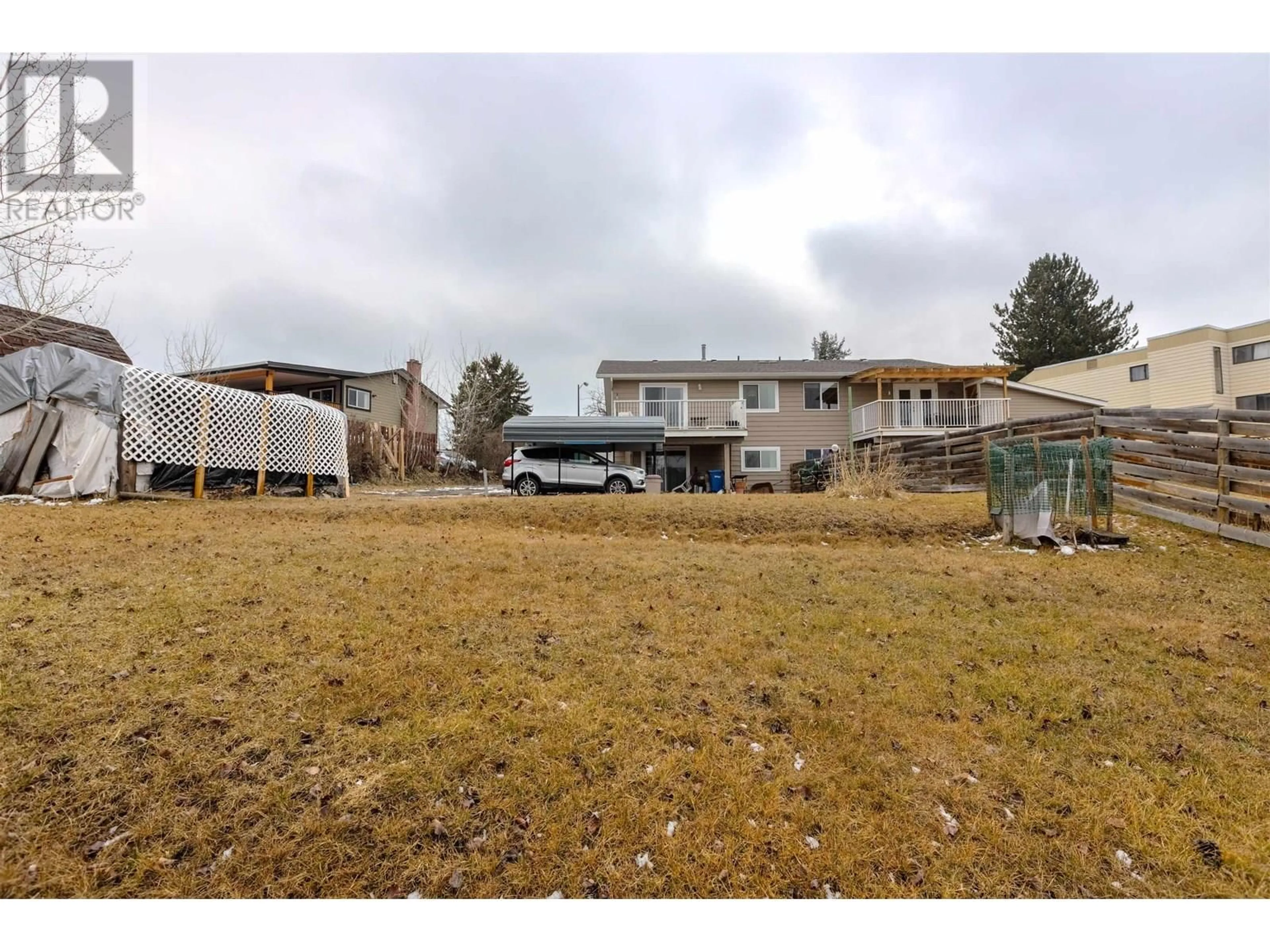 A pic from outside/outdoor area/front of a property/back of a property/a pic from drone, mountain view for 238 ELM AVENUE, 100 Mile House British Columbia V0K2E0