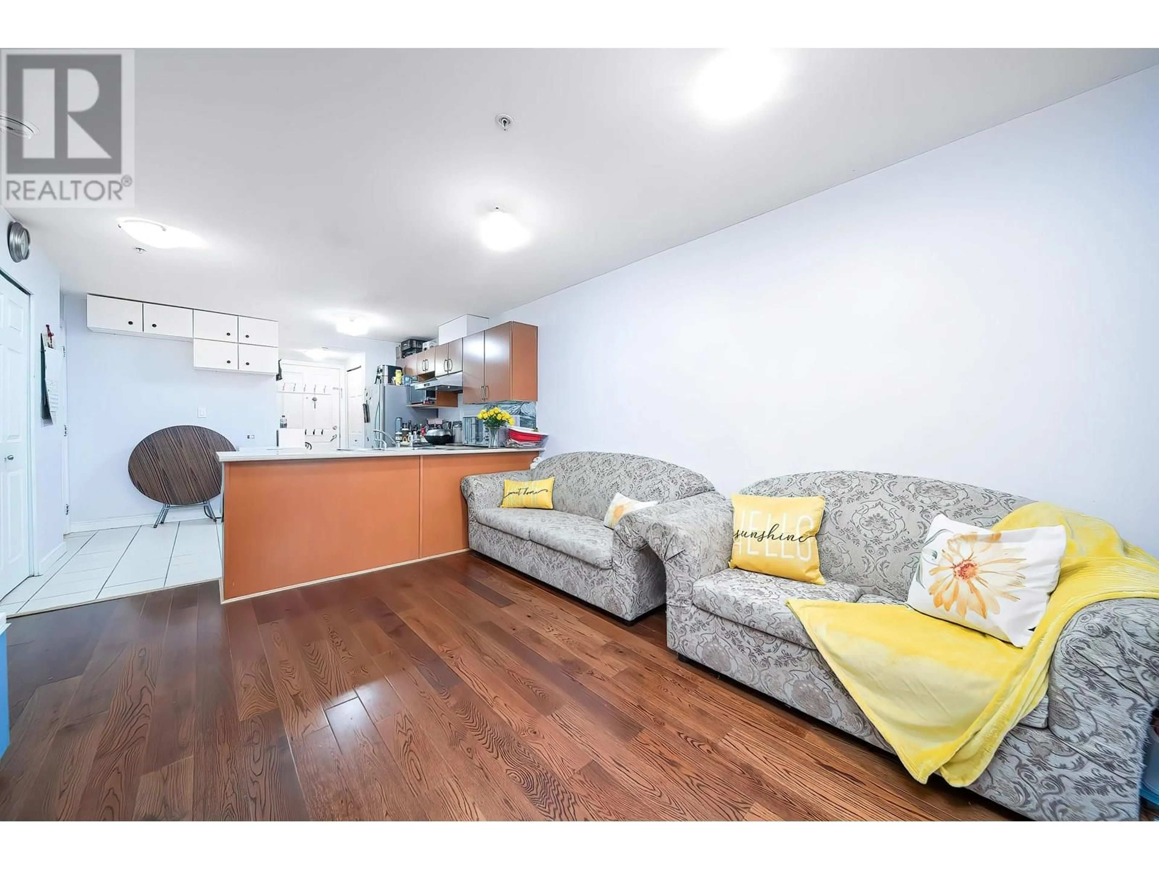 Living room with furniture, wood/laminate floor for 206 - 2028 37TH AVENUE, Vancouver British Columbia V5P1G2