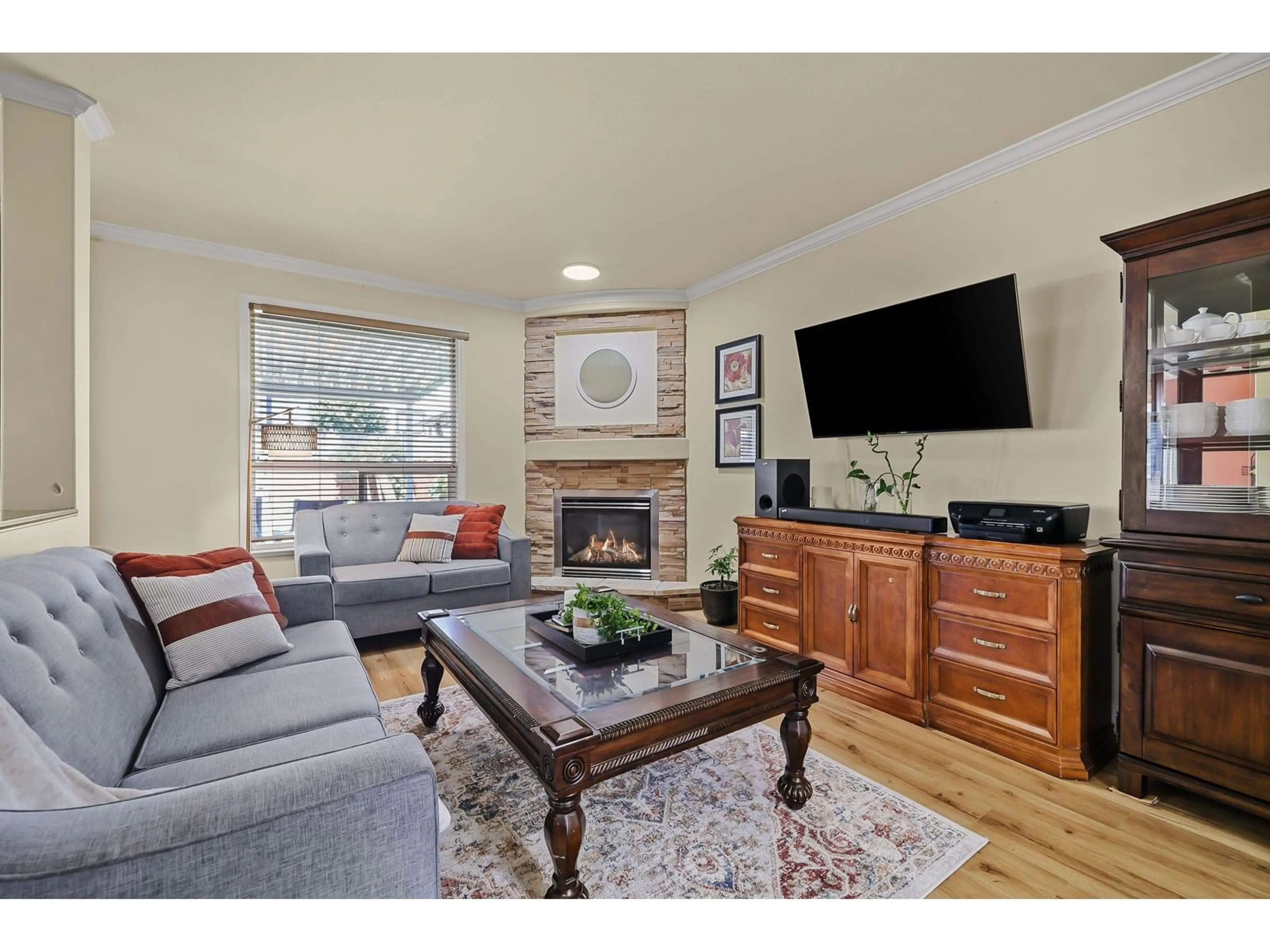 Living room with furniture, wood/laminate floor for 18629 56B, Surrey British Columbia V3S7N2