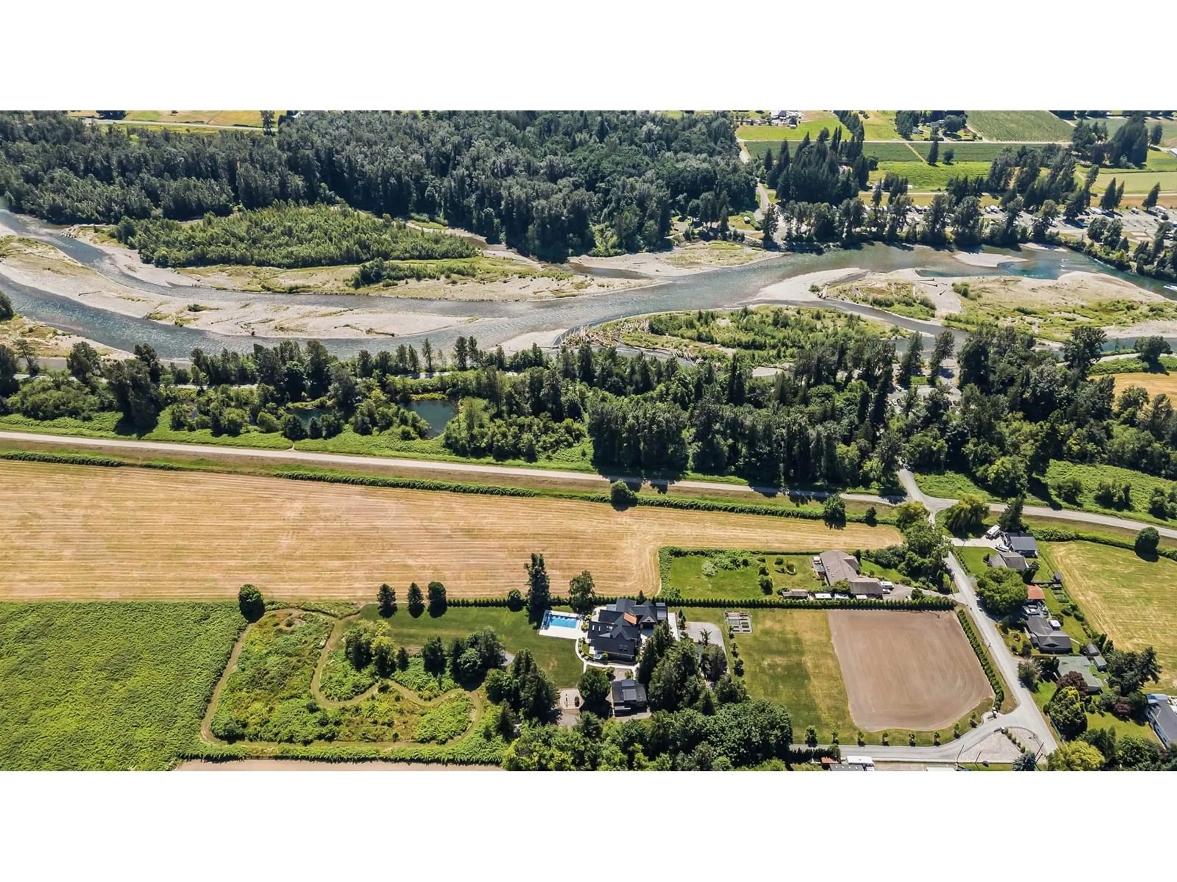 A pic from outside/outdoor area/front of a property/back of a property/a pic from drone, water/lake/river/ocean view for 5474 LICKMAN ROAD, Sardis - Greendale British Columbia V2R4P8
