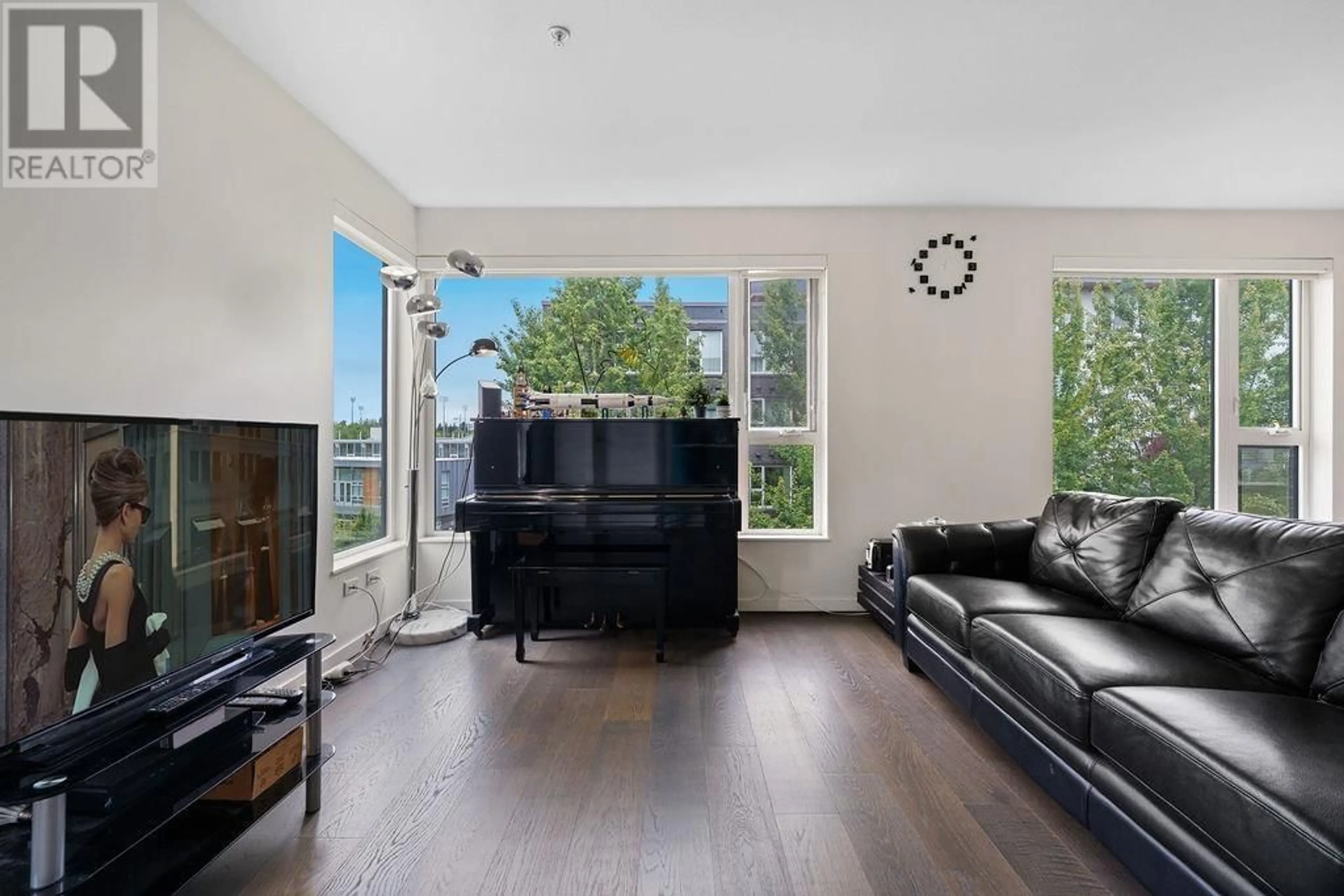Living room with furniture, wood/laminate floor for 610 - 5955 BIRNEY AVENUE, Vancouver British Columbia V6S0C5