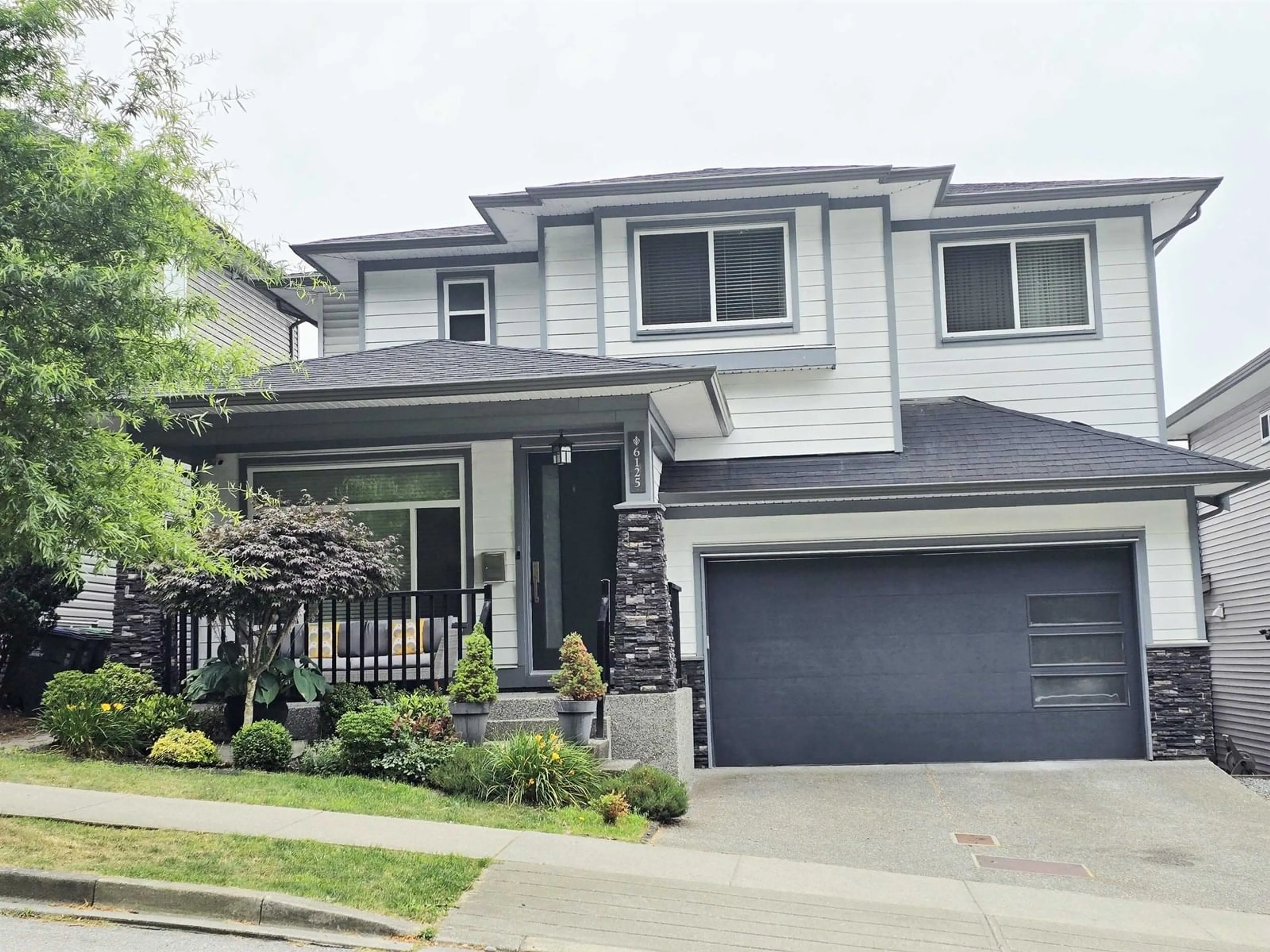Home with vinyl exterior material, street for 6125 146, Surrey British Columbia V3S3A1
