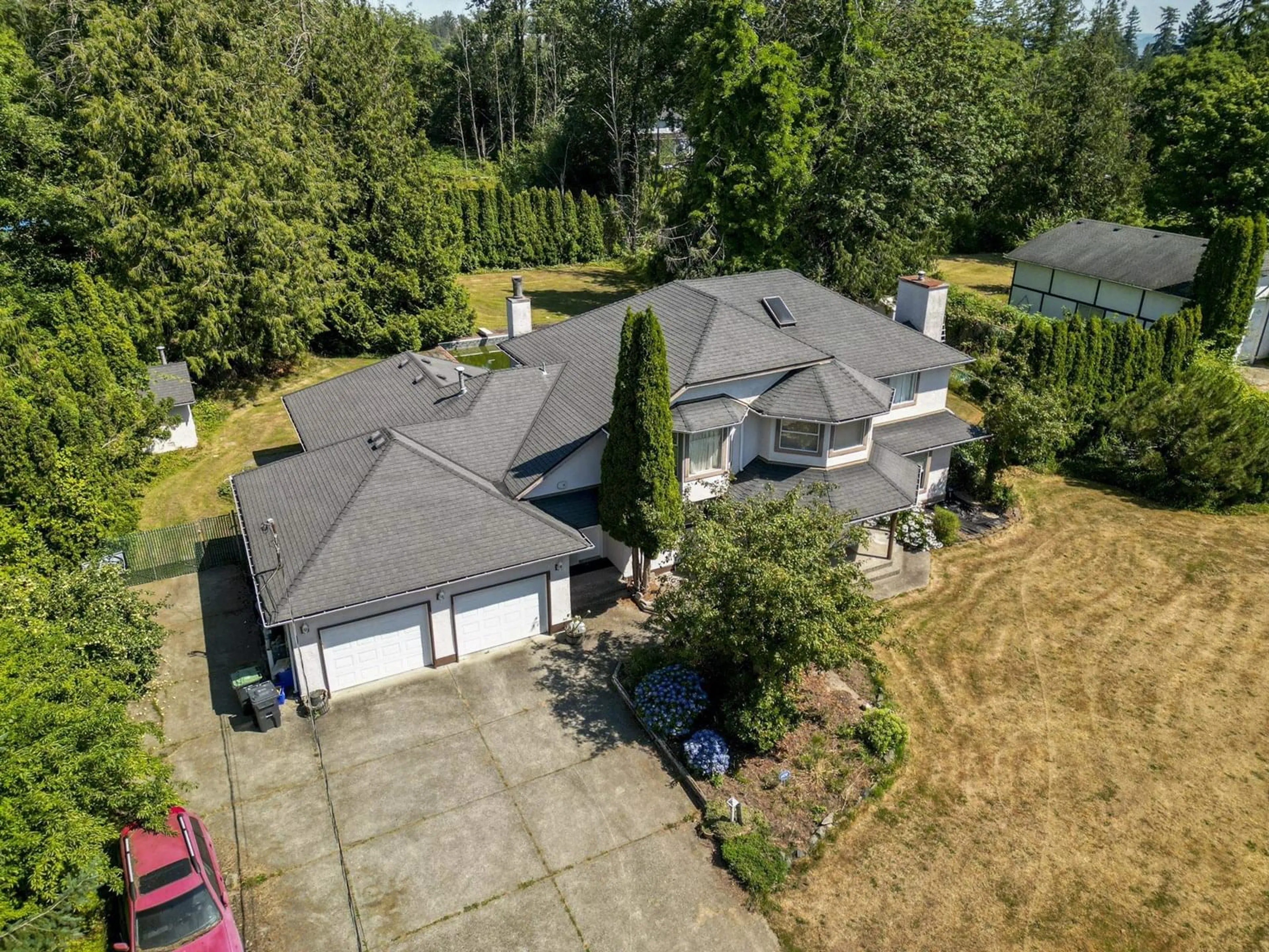 A pic from outside/outdoor area/front of a property/back of a property/a pic from drone, unknown for 20745 68TH, Langley British Columbia V2Y1R1