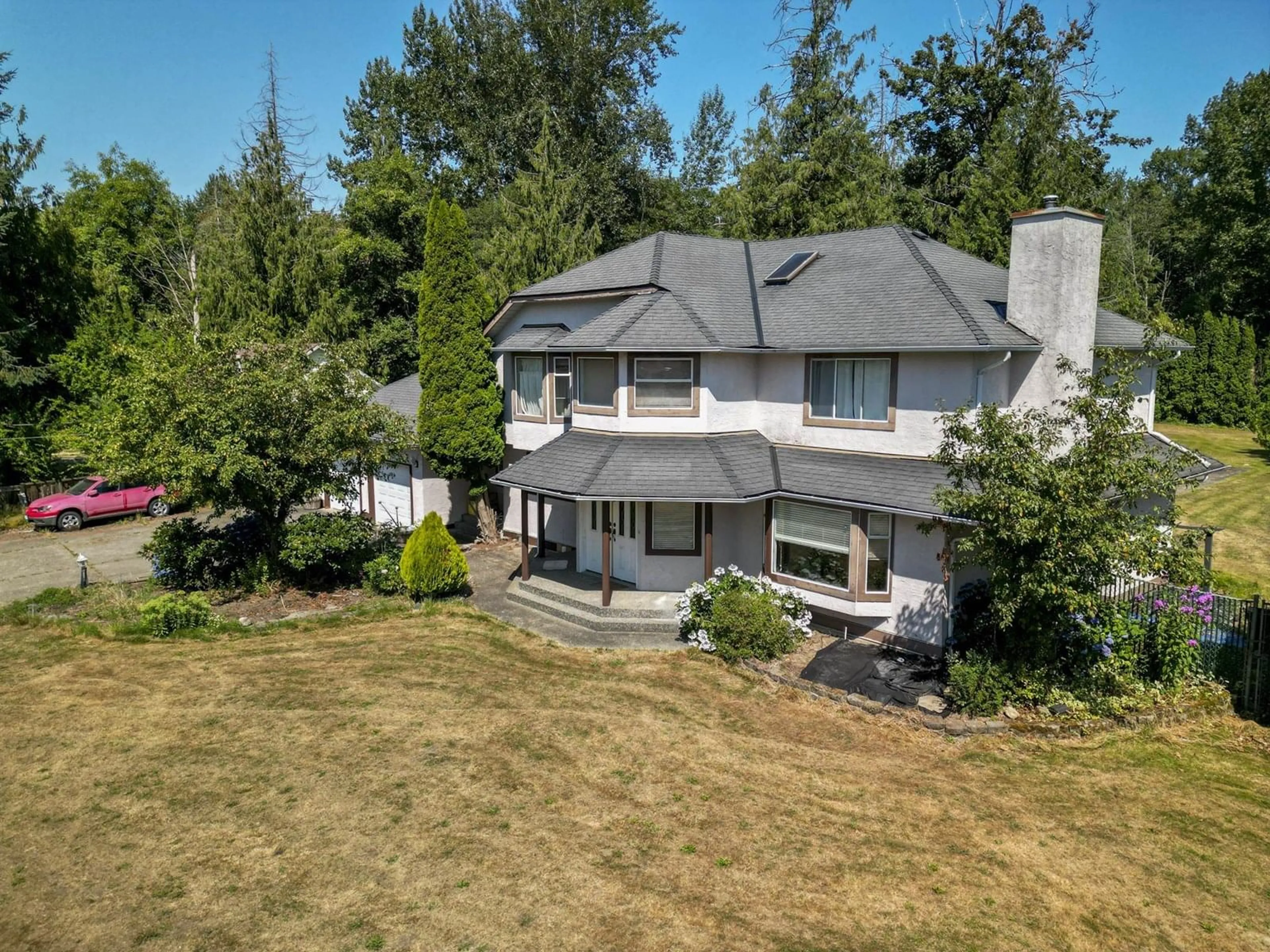 A pic from outside/outdoor area/front of a property/back of a property/a pic from drone, unknown for 20745 68TH, Langley British Columbia V2Y1R1