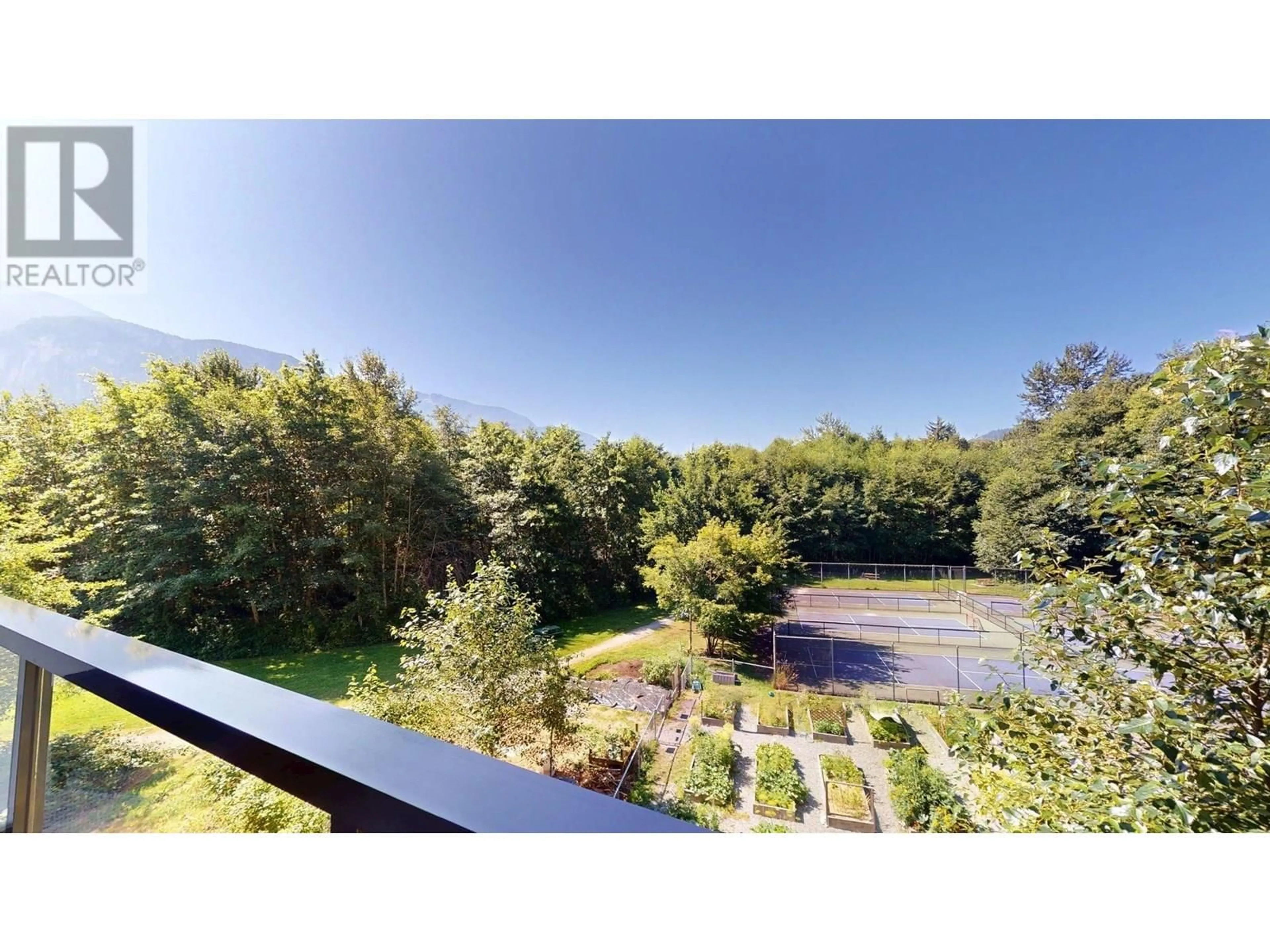 A pic from outside/outdoor area/front of a property/back of a property/a pic from drone, forest/trees view for 402 - 1150 BAILEY STREET, Squamish British Columbia V8B0R4