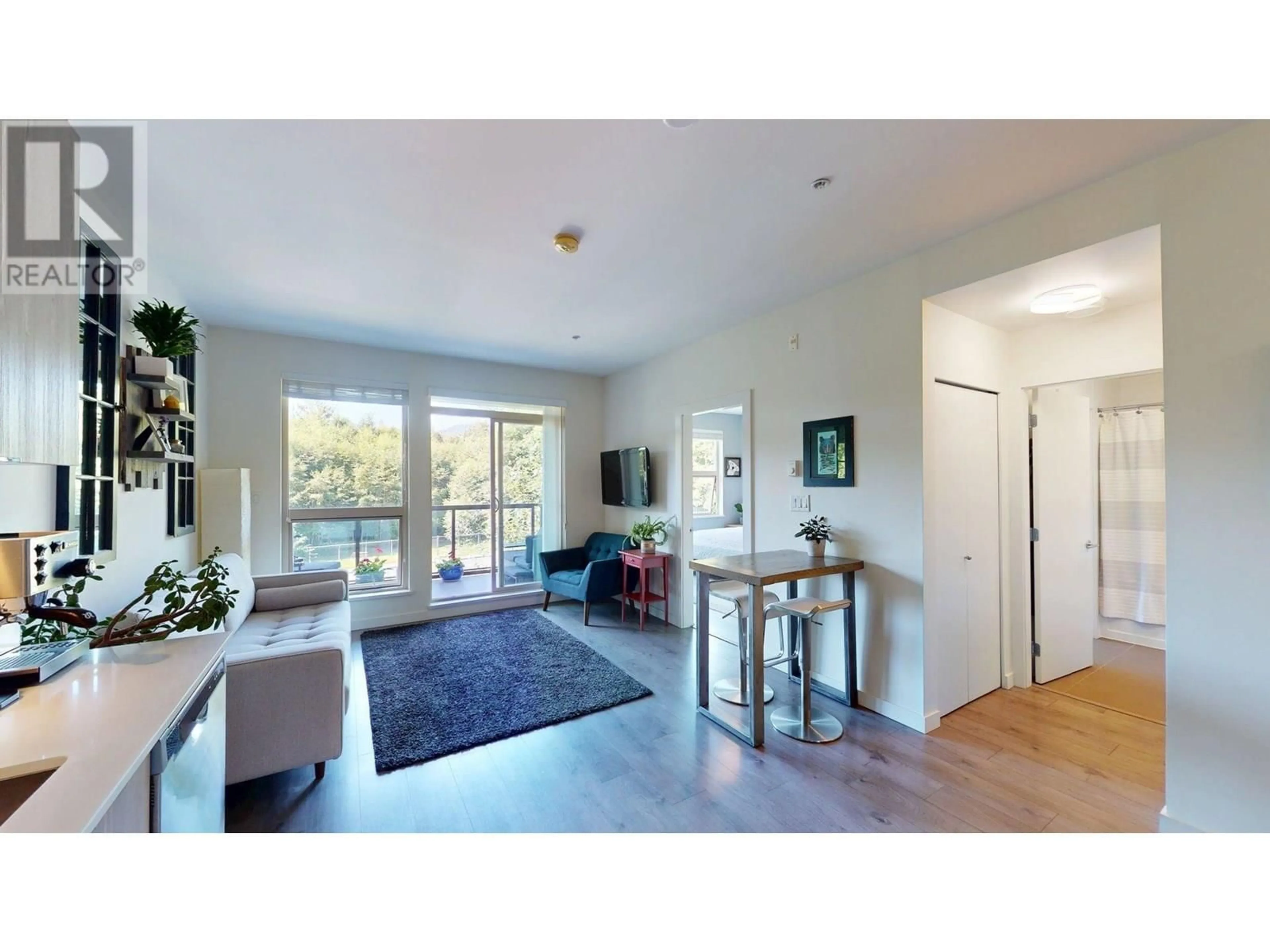 Living room with furniture, wood/laminate floor for 402 - 1150 BAILEY STREET, Squamish British Columbia V8B0R4