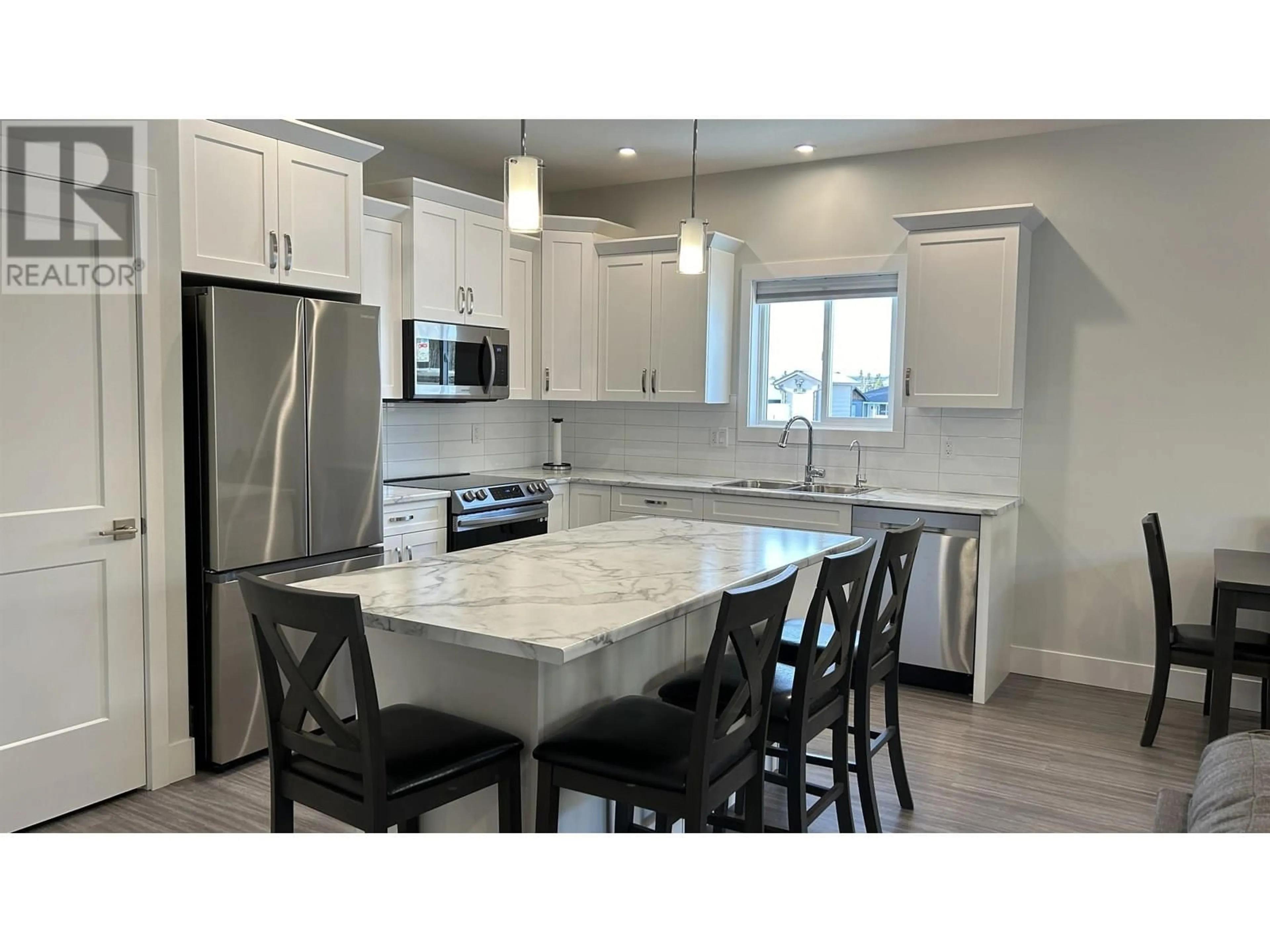 Open concept kitchen, ceramic/tile floor for 1 - 105 FOREST RIDGE ROAD, 100 Mile House British Columbia V0K2E0