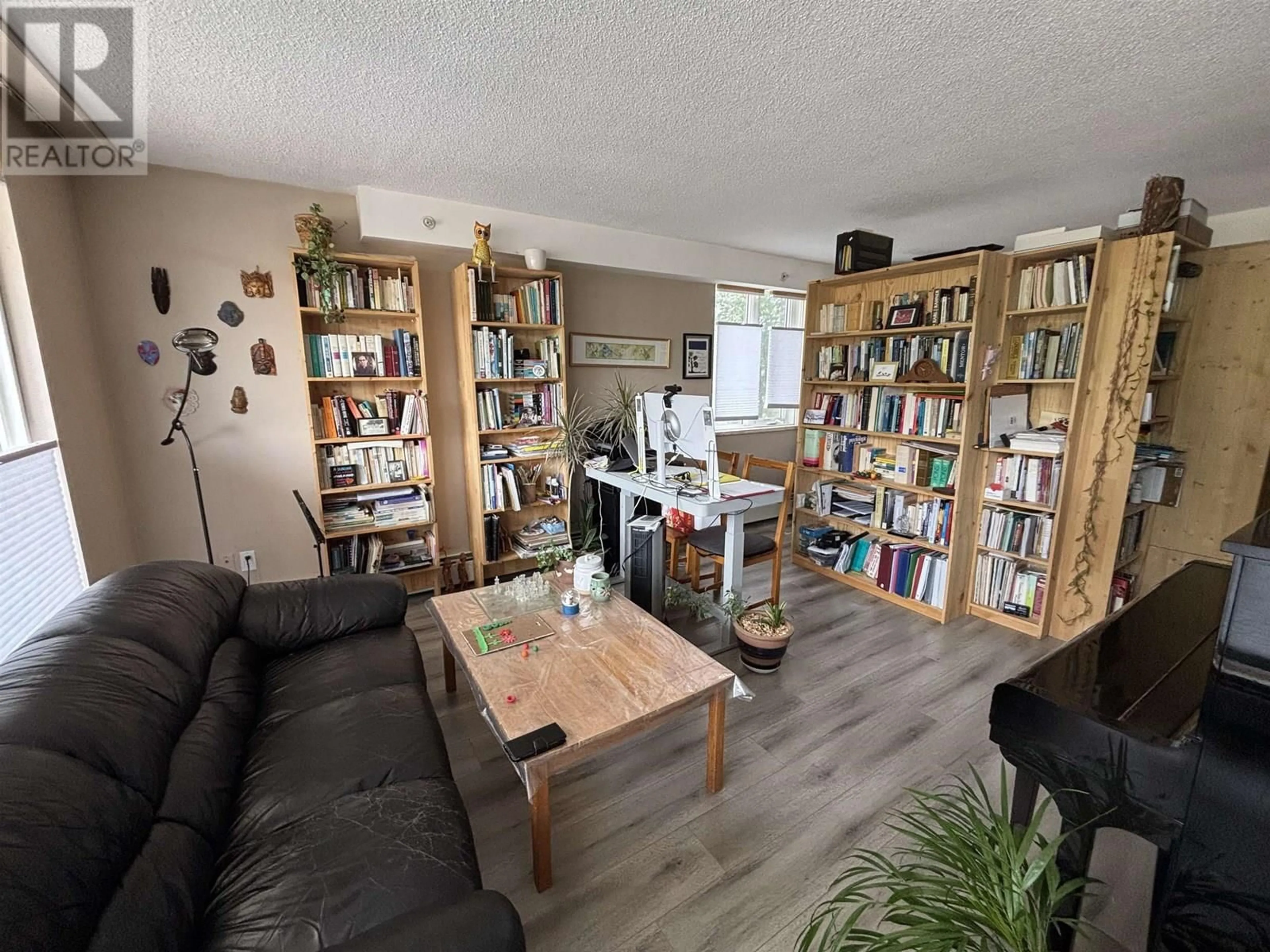 Living room with furniture, wood/laminate floor for 302 - 1501 QUEENSWAY, Prince George British Columbia V2L1L5