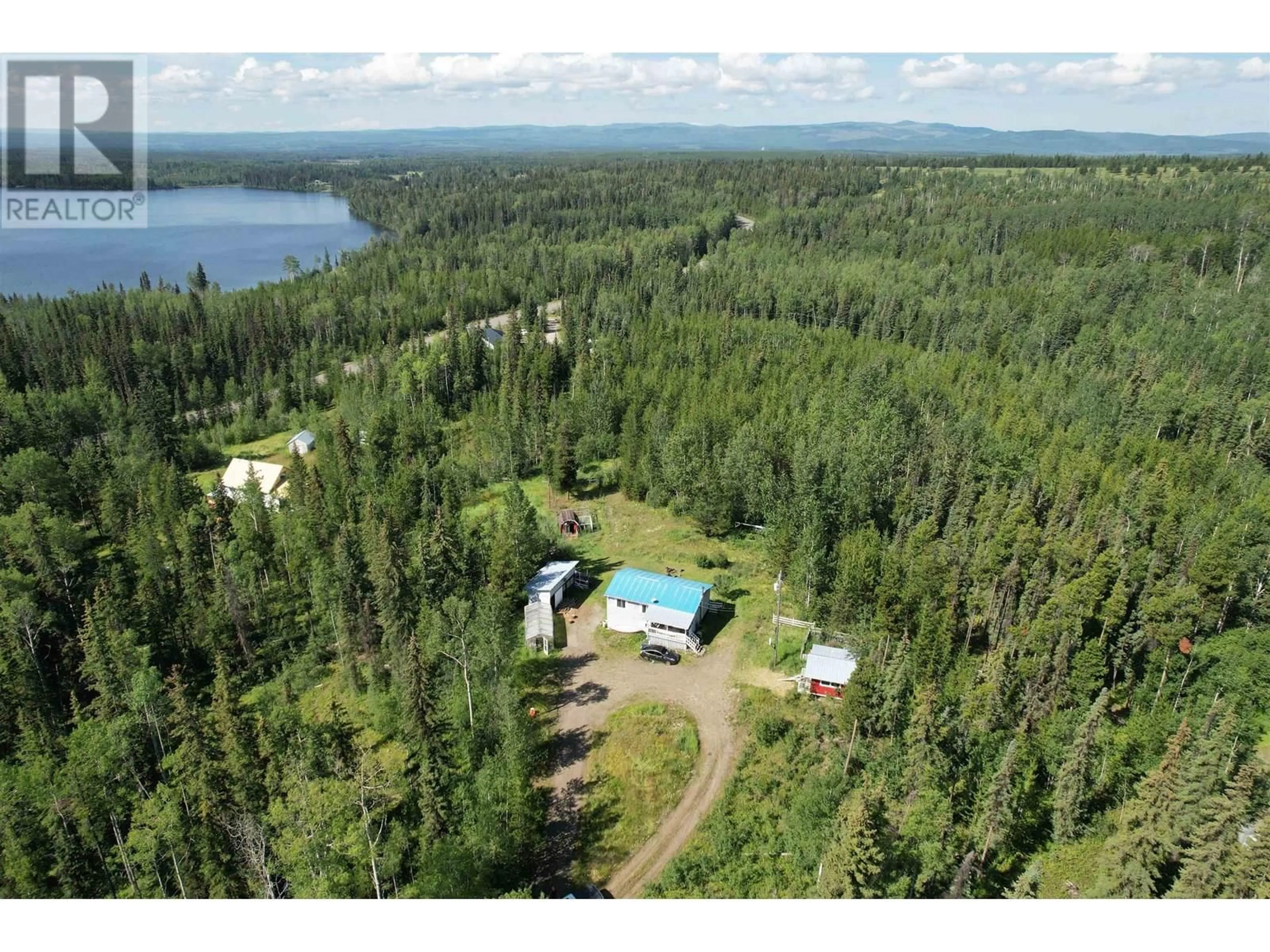 A pic from outside/outdoor area/front of a property/back of a property/a pic from drone, water/lake/river/ocean view for 1053 RAINBOW ROAD, Quesnel British Columbia V2J3H9