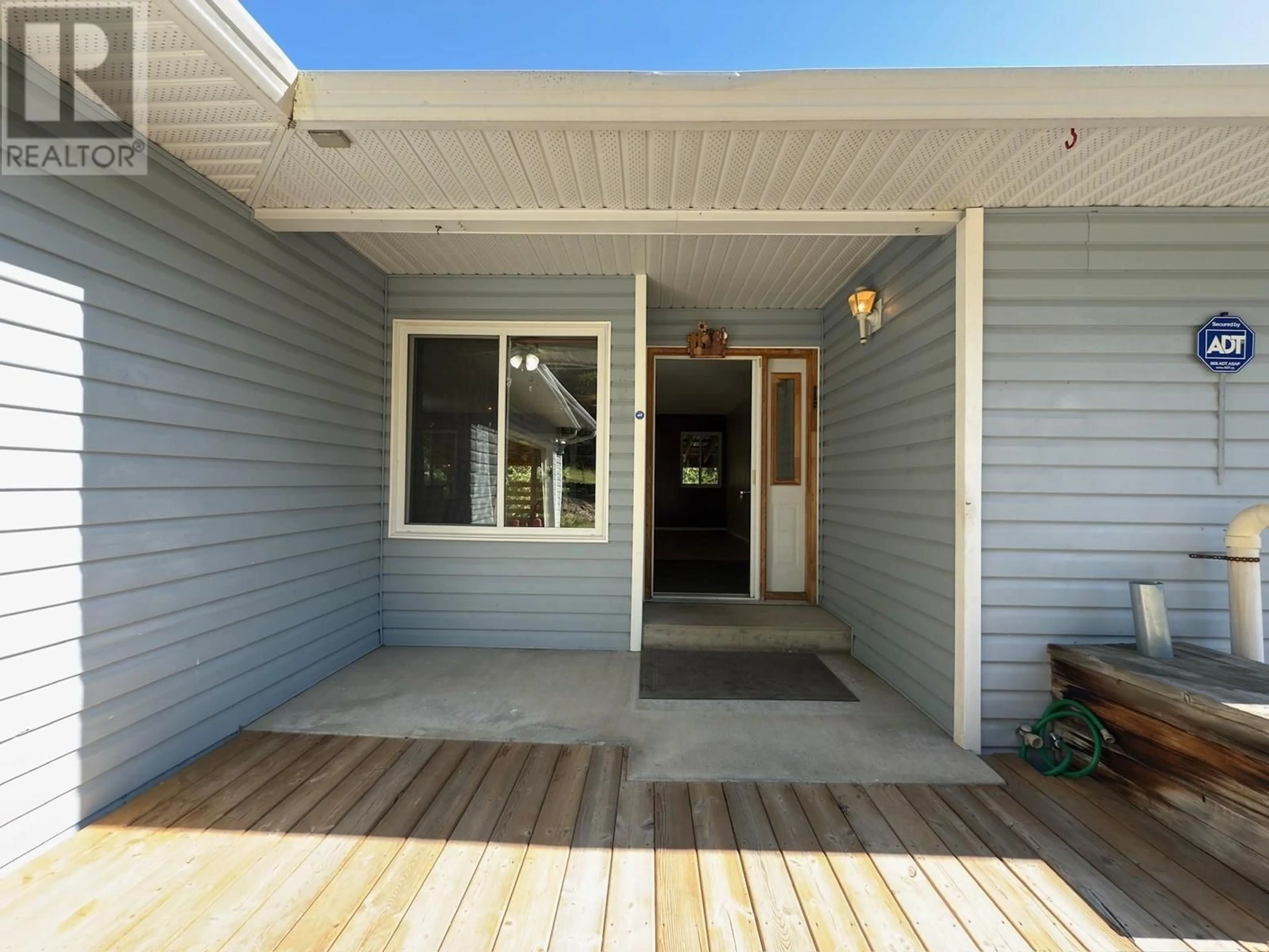 Home with vinyl exterior material, street for 3251 PIGEON ROAD, 150 Mile House British Columbia V0K2G0
