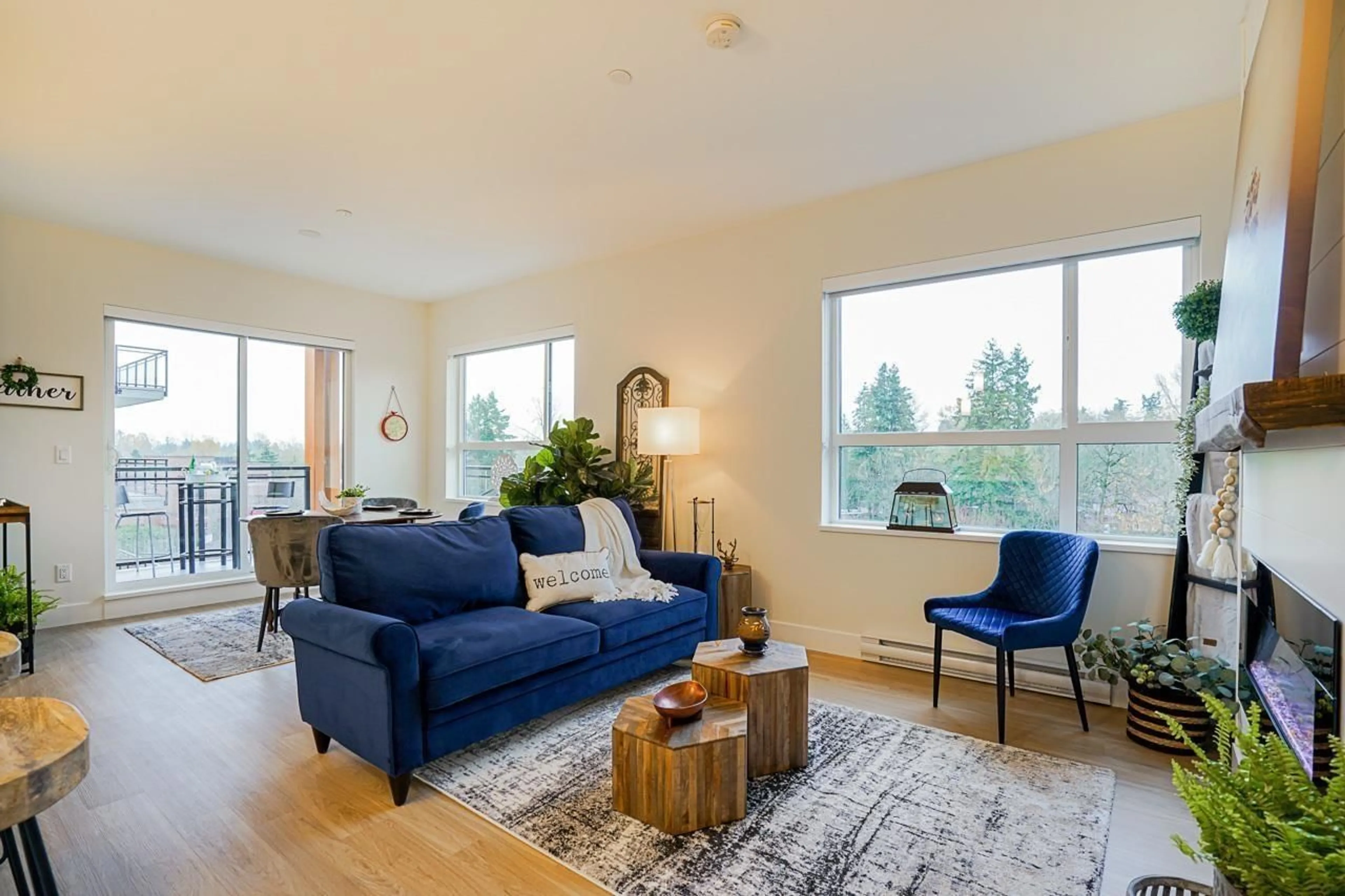 Living room with furniture, wood/laminate floor for 415 - 6960 NICHOLSON, Delta British Columbia V4E0A9