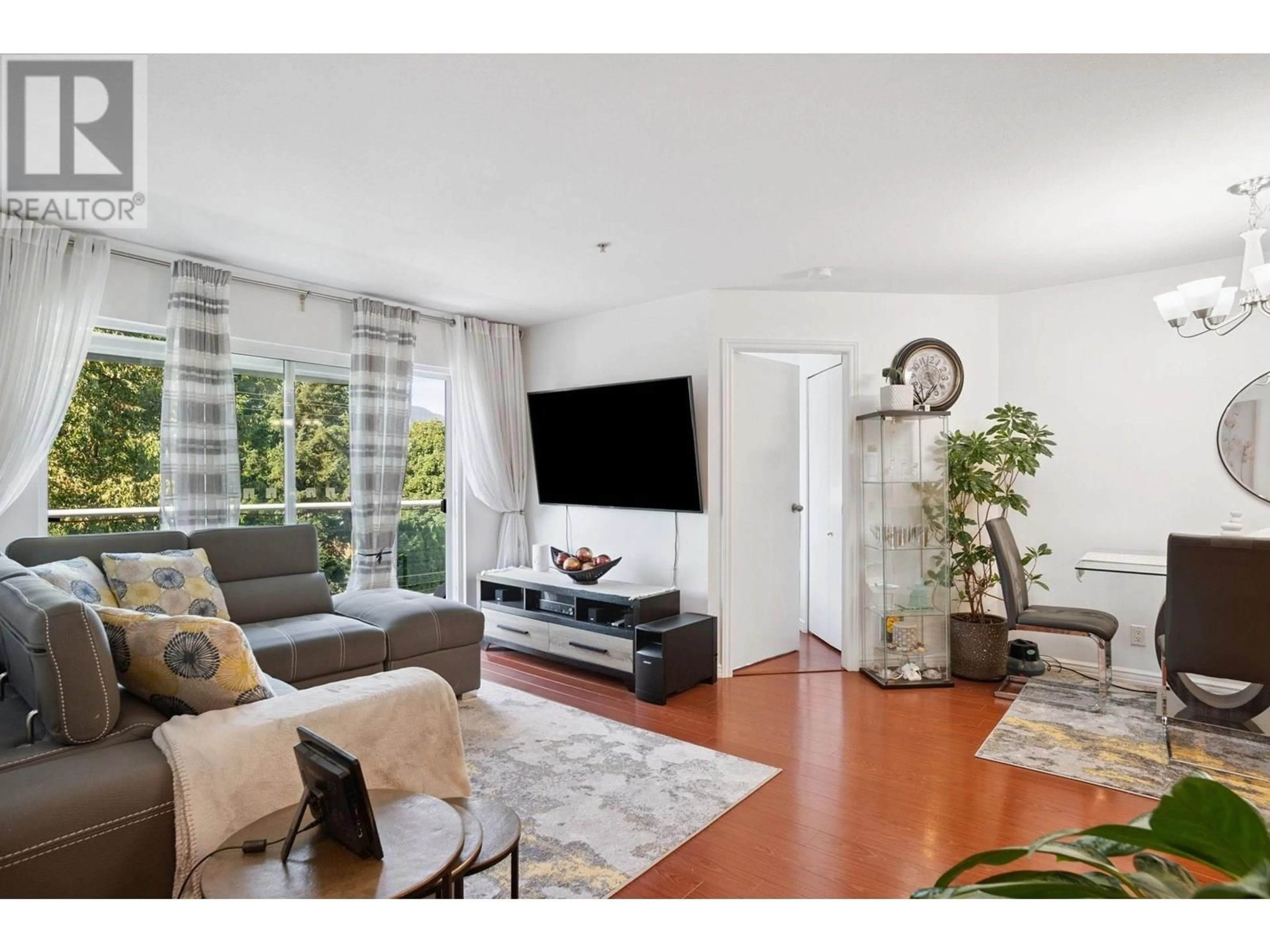 Living room with furniture, unknown for 402 - 2983 CAMBRIDGE STREET, Port Coquitlam British Columbia V3B7N7