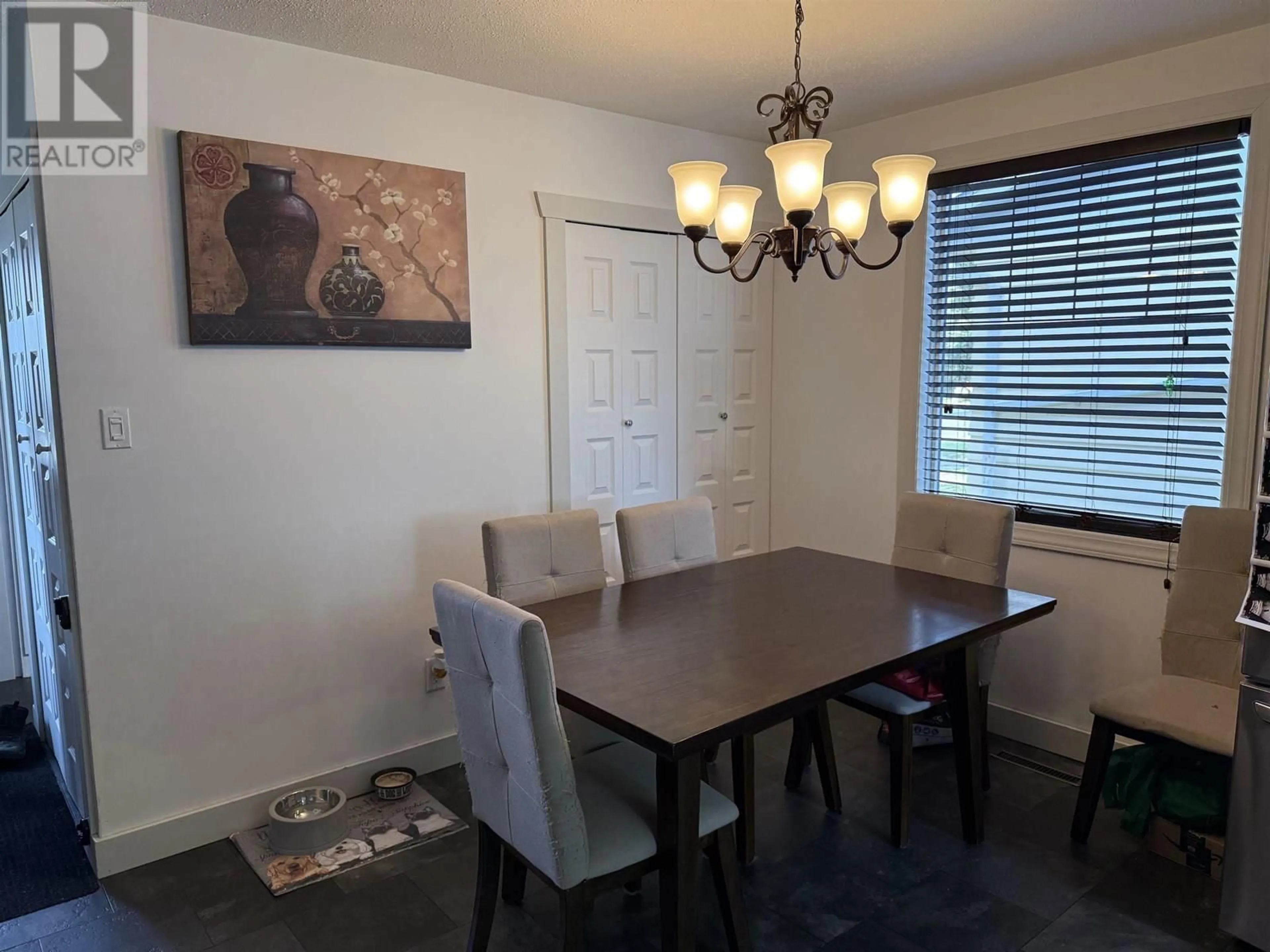 Dining room, wood/laminate floor for 9527 112 AVENUE, Fort St. John British Columbia V1J2W1