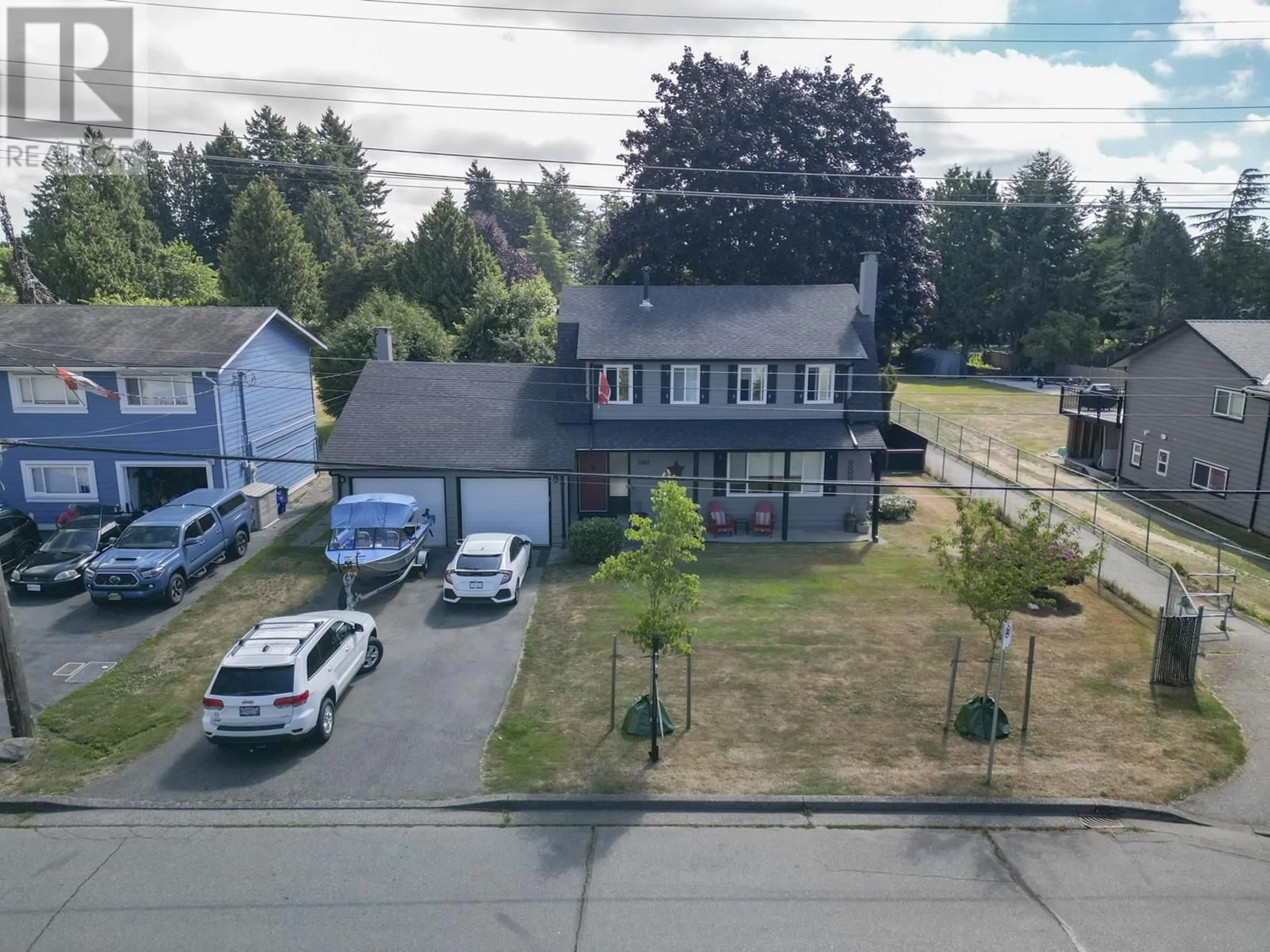 A pic from outside/outdoor area/front of a property/back of a property/a pic from drone, street for 1380 53A STREET, Delta British Columbia V4M3E6