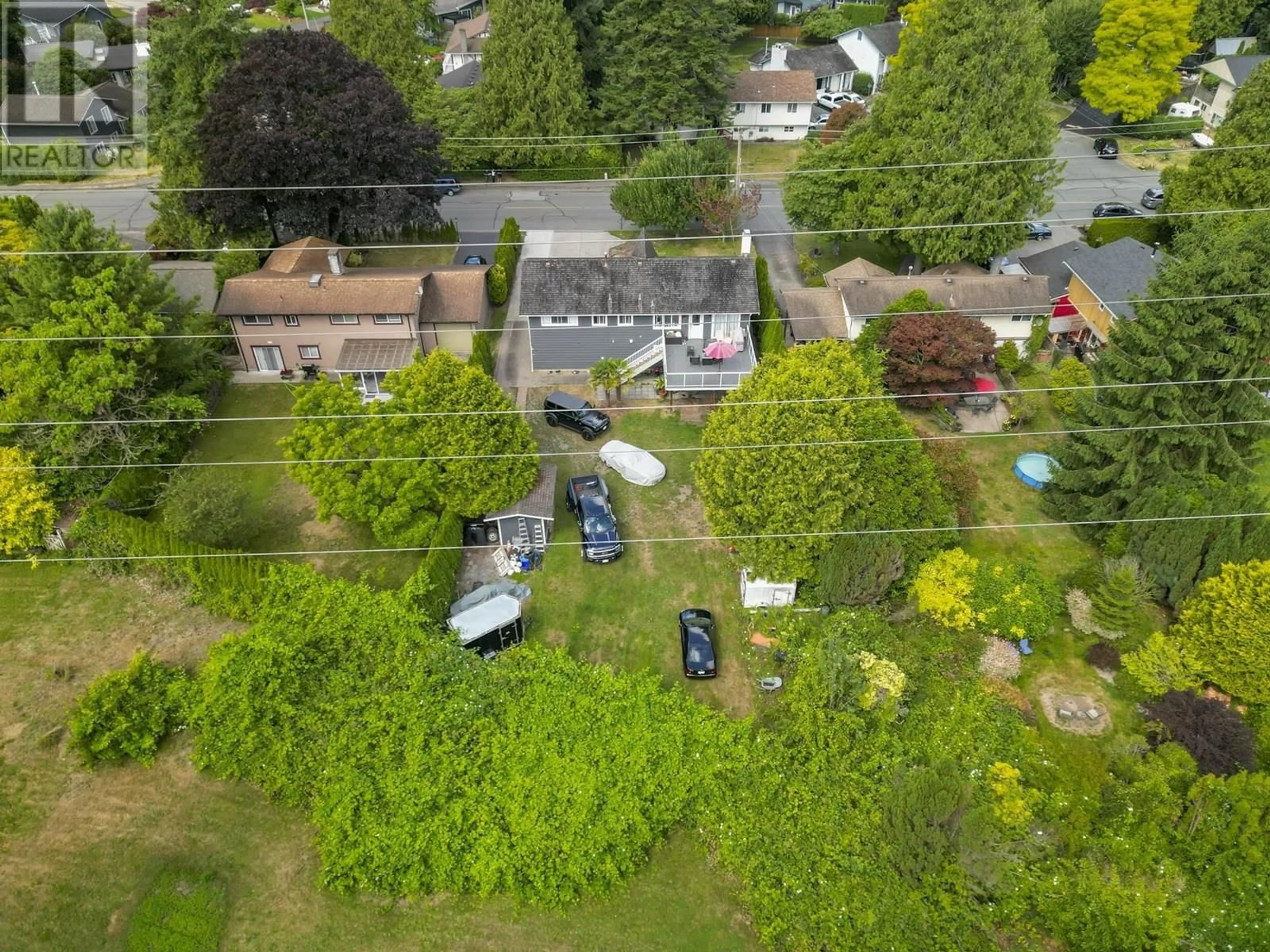 A pic from outside/outdoor area/front of a property/back of a property/a pic from drone, street for 1474 53A STREET, Delta British Columbia V4M3E6