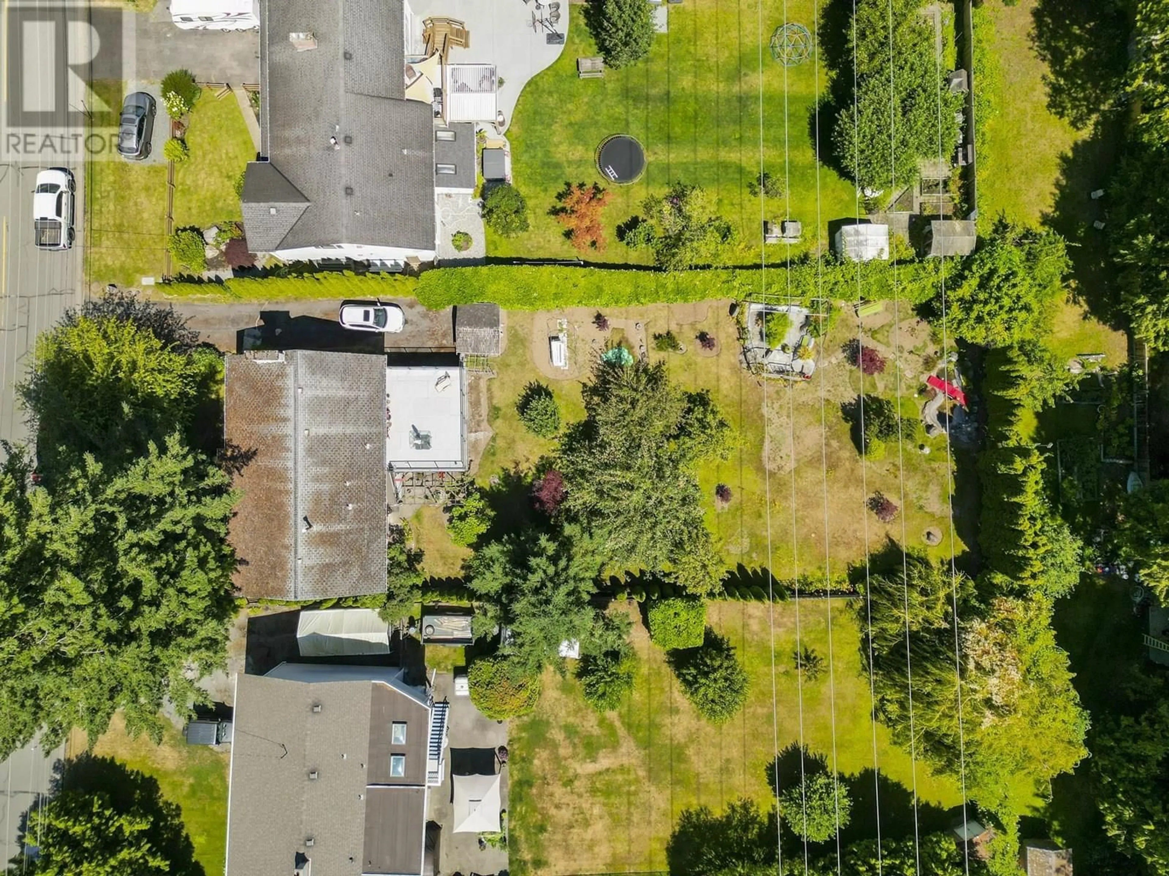 A pic from outside/outdoor area/front of a property/back of a property/a pic from drone, street for 1546 53A STREET, Delta British Columbia V4M3G2