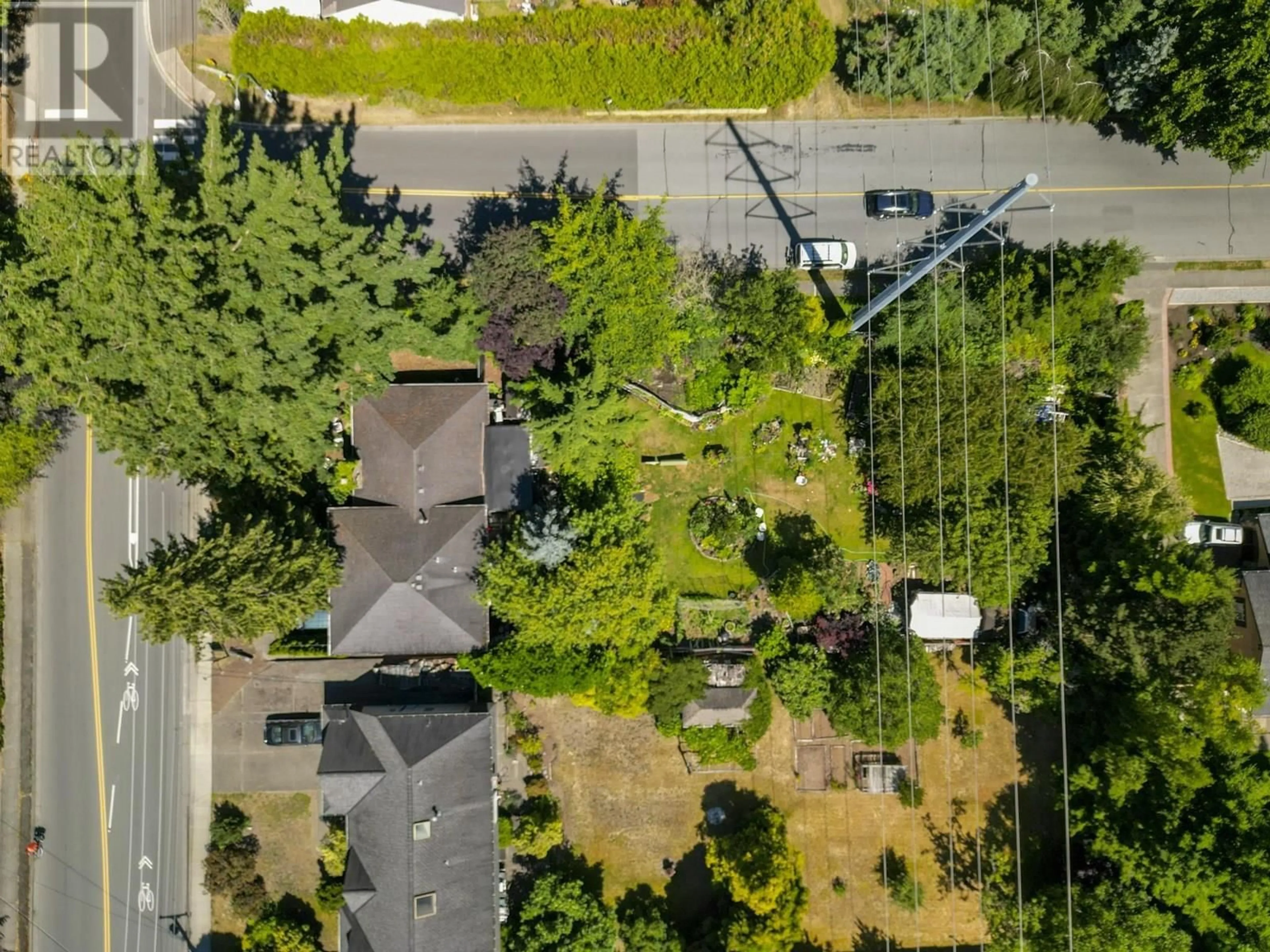 A pic from outside/outdoor area/front of a property/back of a property/a pic from drone, forest/trees view for 1590 53A STREET, Delta British Columbia V4M3G2