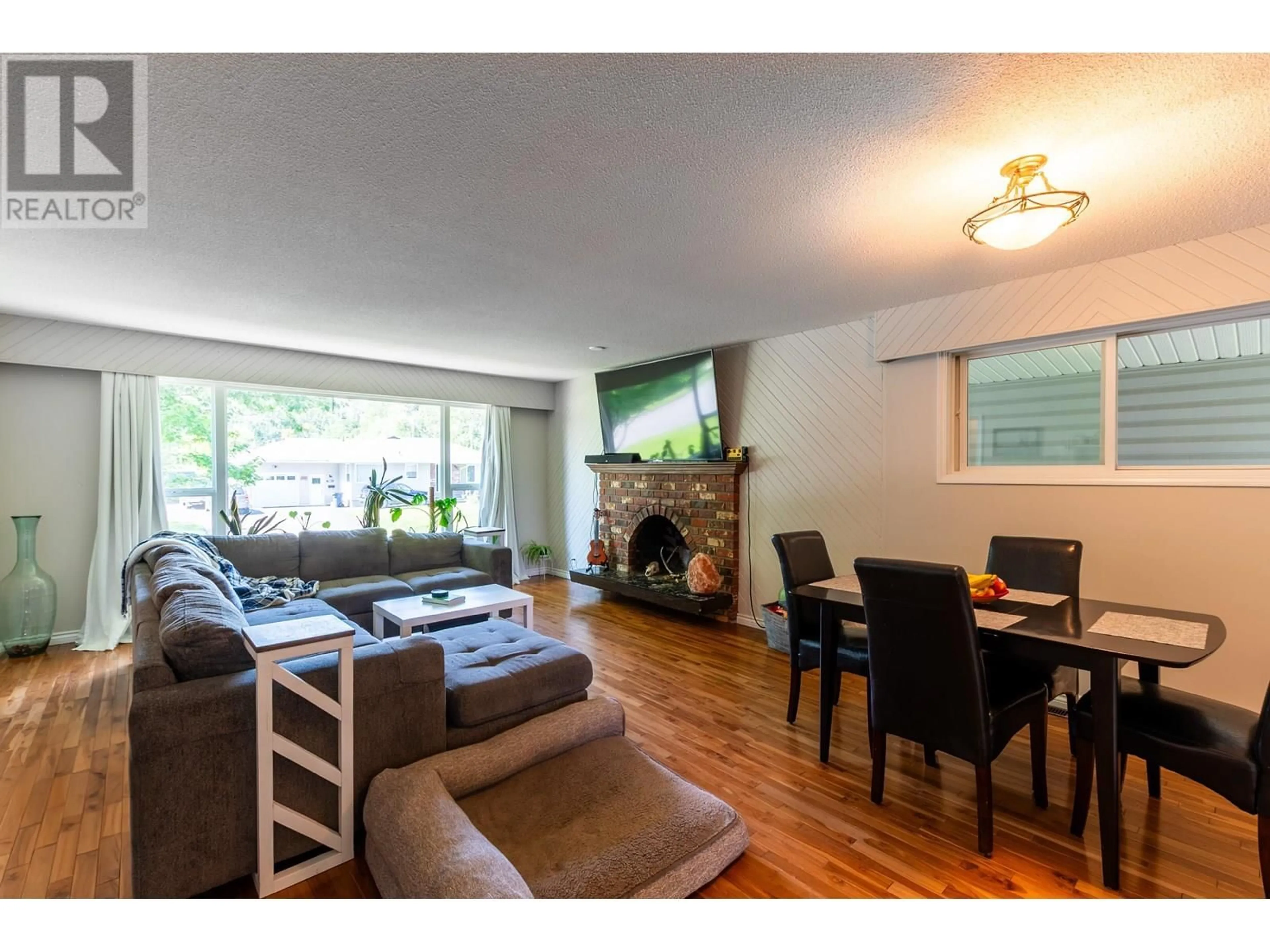 Living room with furniture, wood/laminate floor for 1678 KENWOOD STREET, Prince George British Columbia V2L1S2